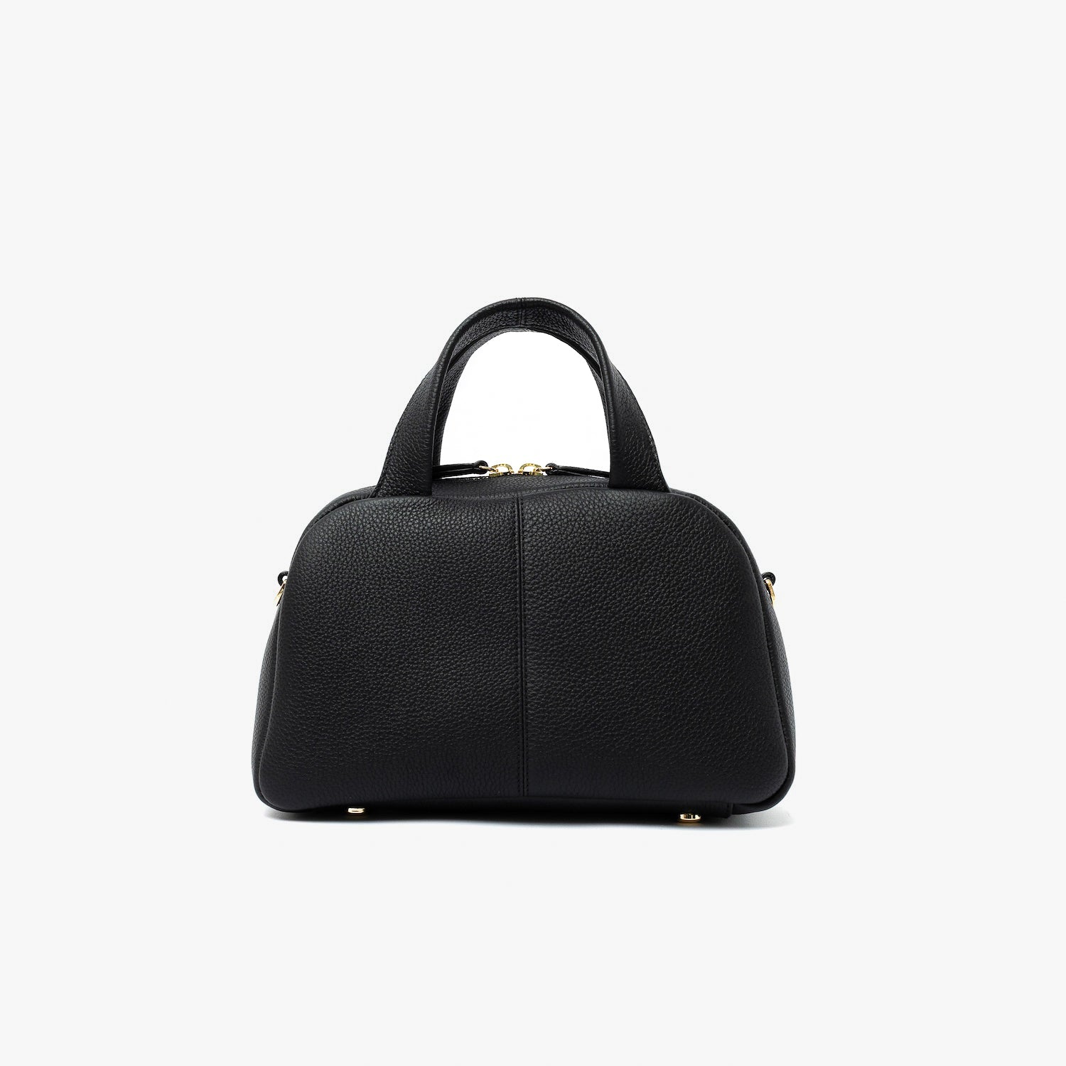 Back panel of STOW London's Mini Bowling bag in Black pebbled leather featuring gold-coated stainless steel hardware and four feet on the base on a light grey background