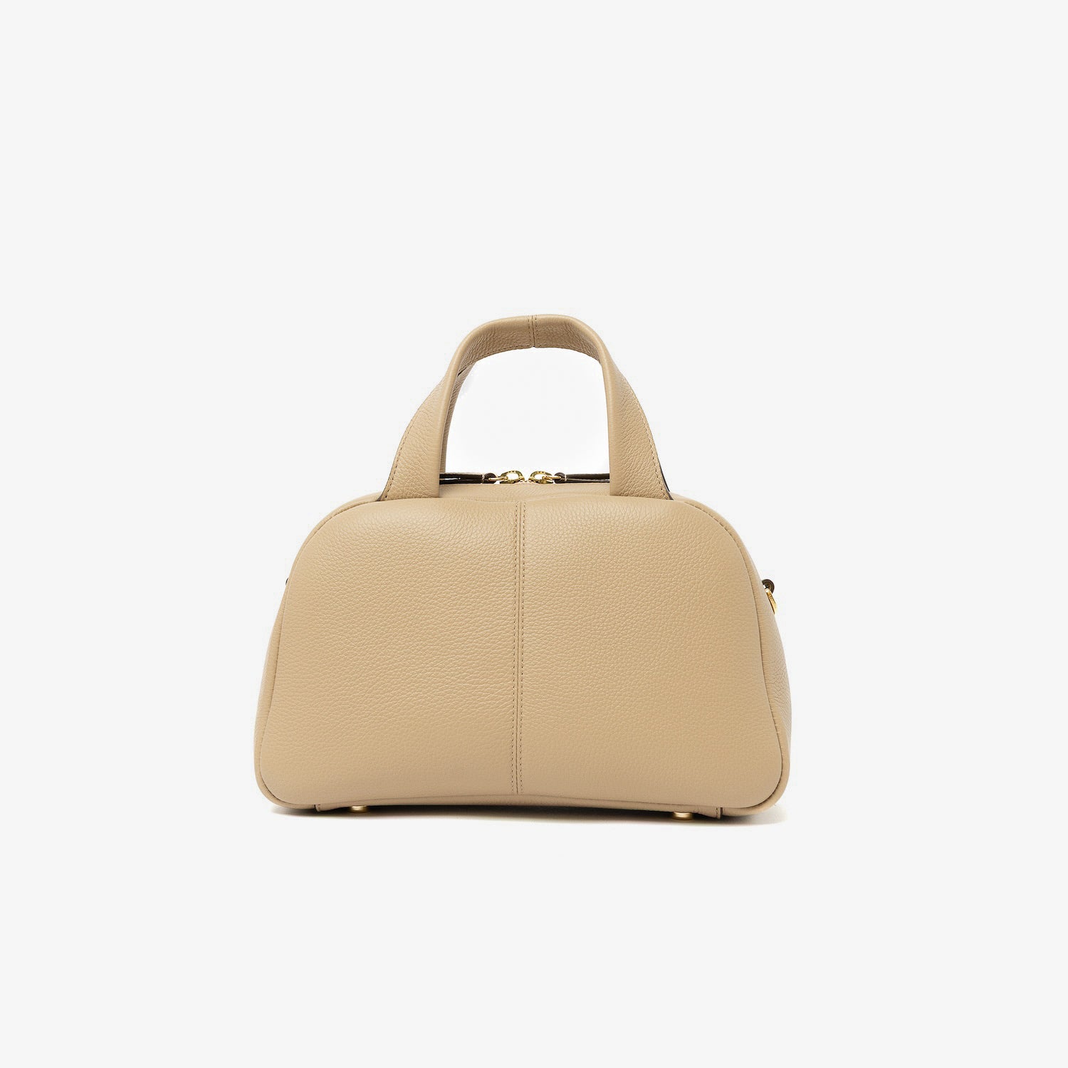 Back panel of STOW London's Mini Bowling bag in Camel pebbled leather featuring gold-coated stainless steel hardware and four feet on the base on a light grey background