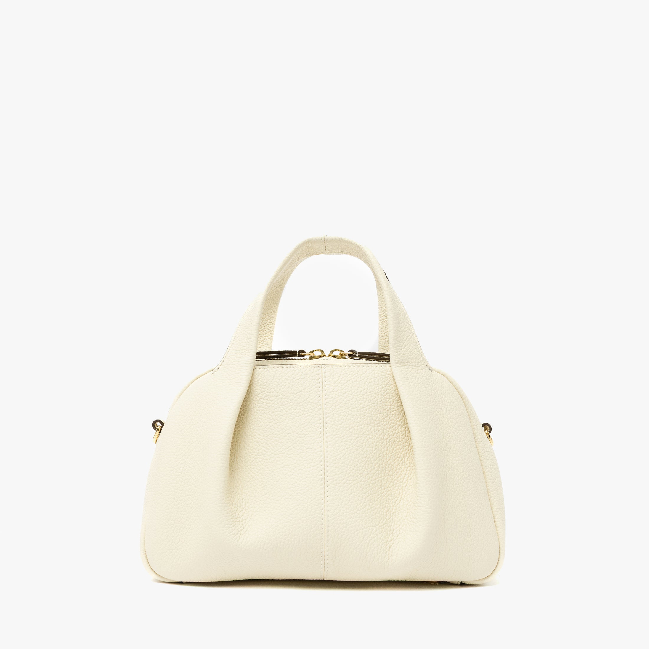 STOW London's Mini Bowling bag in Spring Moon pebbled leather featuring a pleated front panel and gold-coated stainless steel hardware on a light grey background