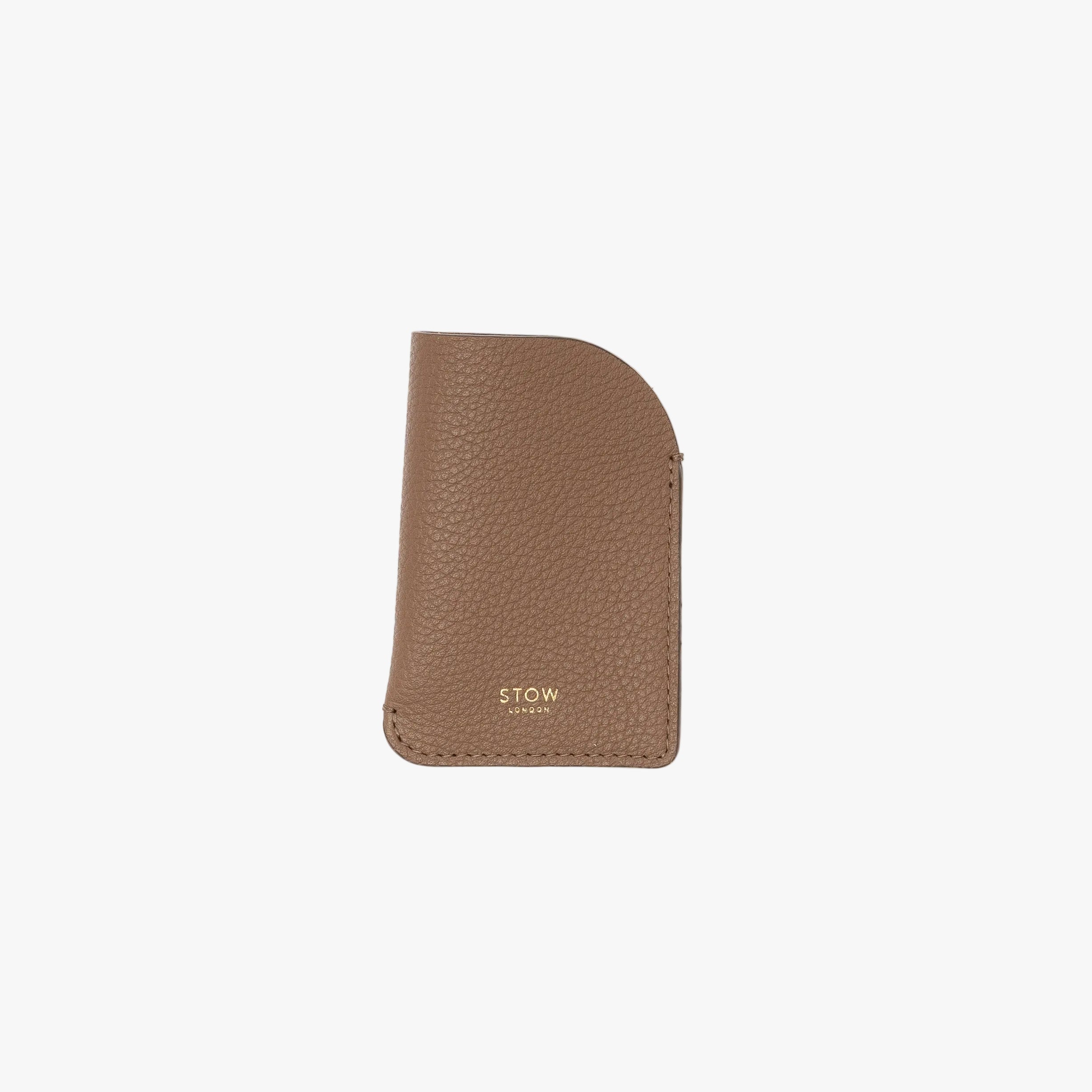STOW London's Mini Cardholder in Mocha pebbled leather on a light grey background featuring a small gold embossed logo on the front bottom