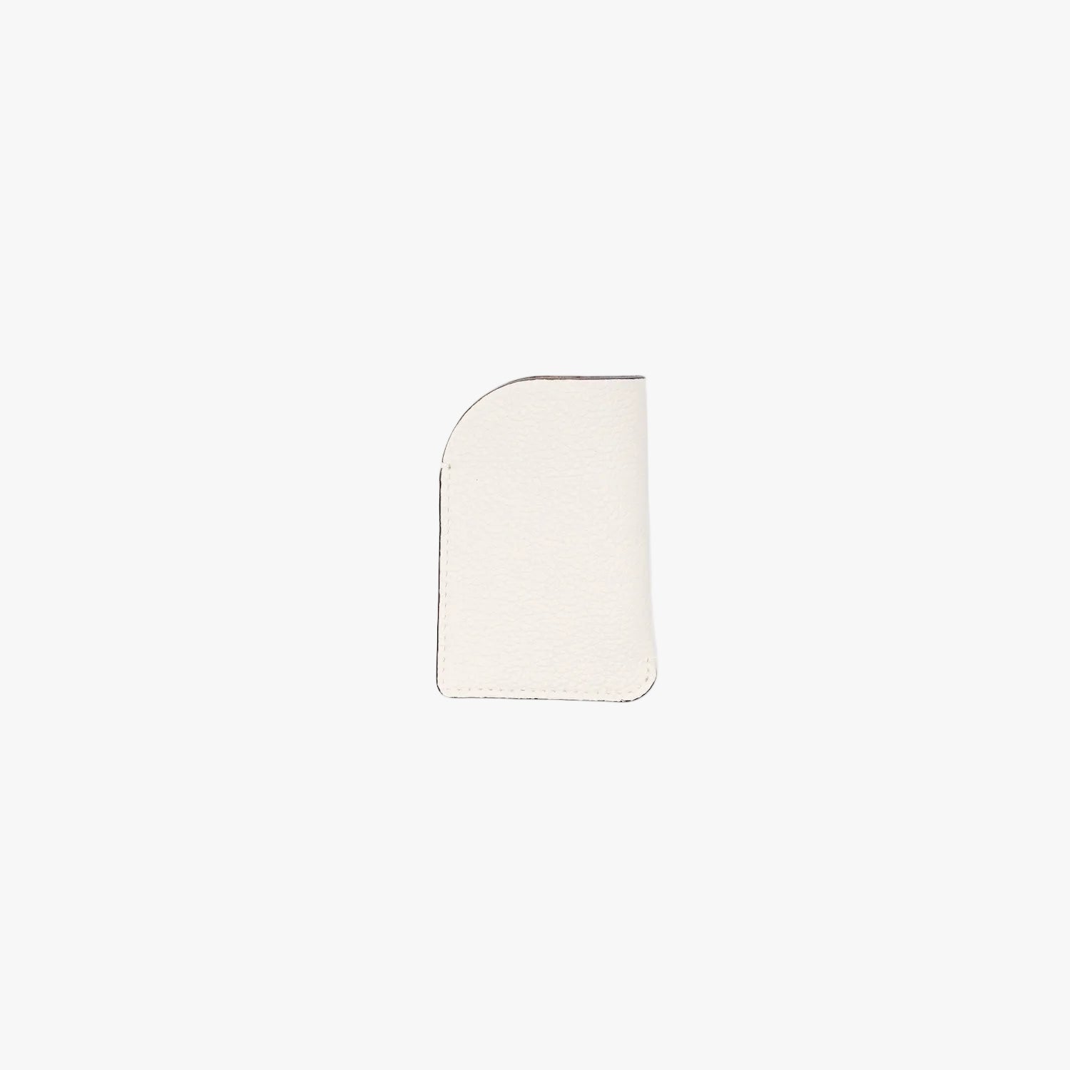 Back panel of STOW London's Mini Cardholder in Cloud Grey pebbled leather on a light grey background
