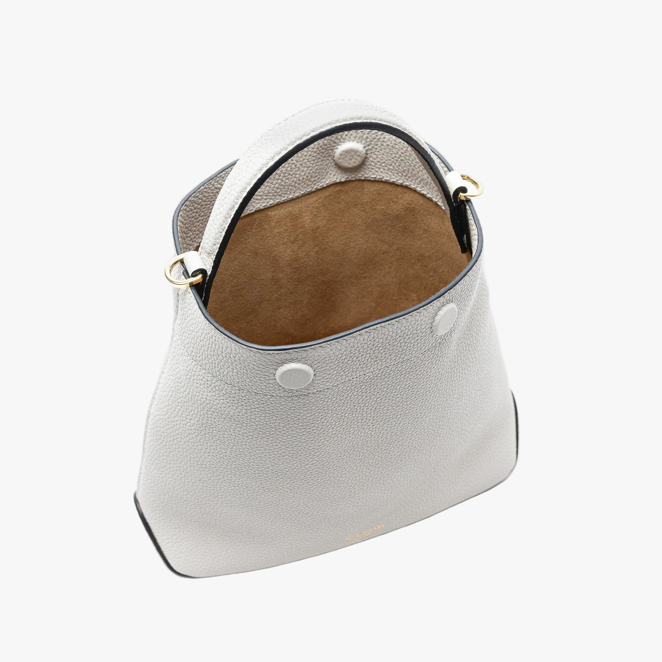 Stow London's Mini Curve in Cloud Grey pebbled leather with magnets open showing hidden magnet closures and cognac suede interior lining on a light grey background