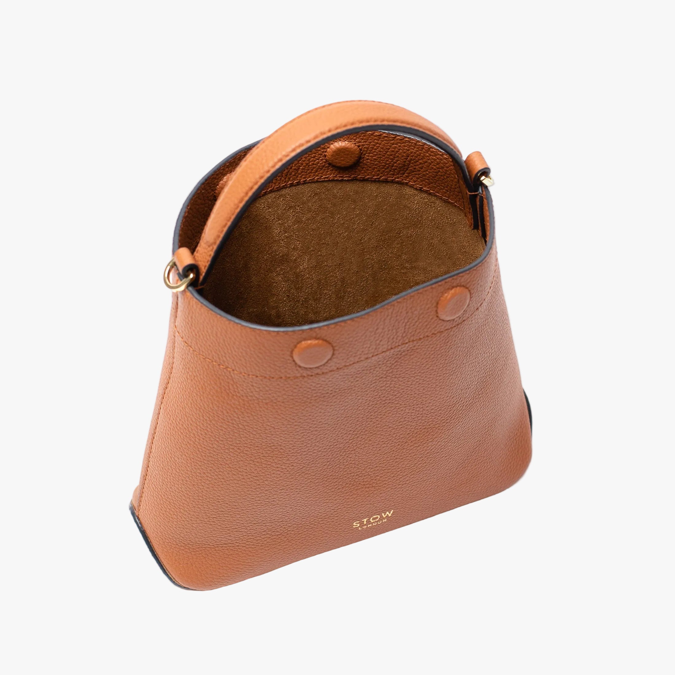 Stow London's Mini Curve in Earth tan pebbled leather with magnets open showing suede interior lining on a light grey background