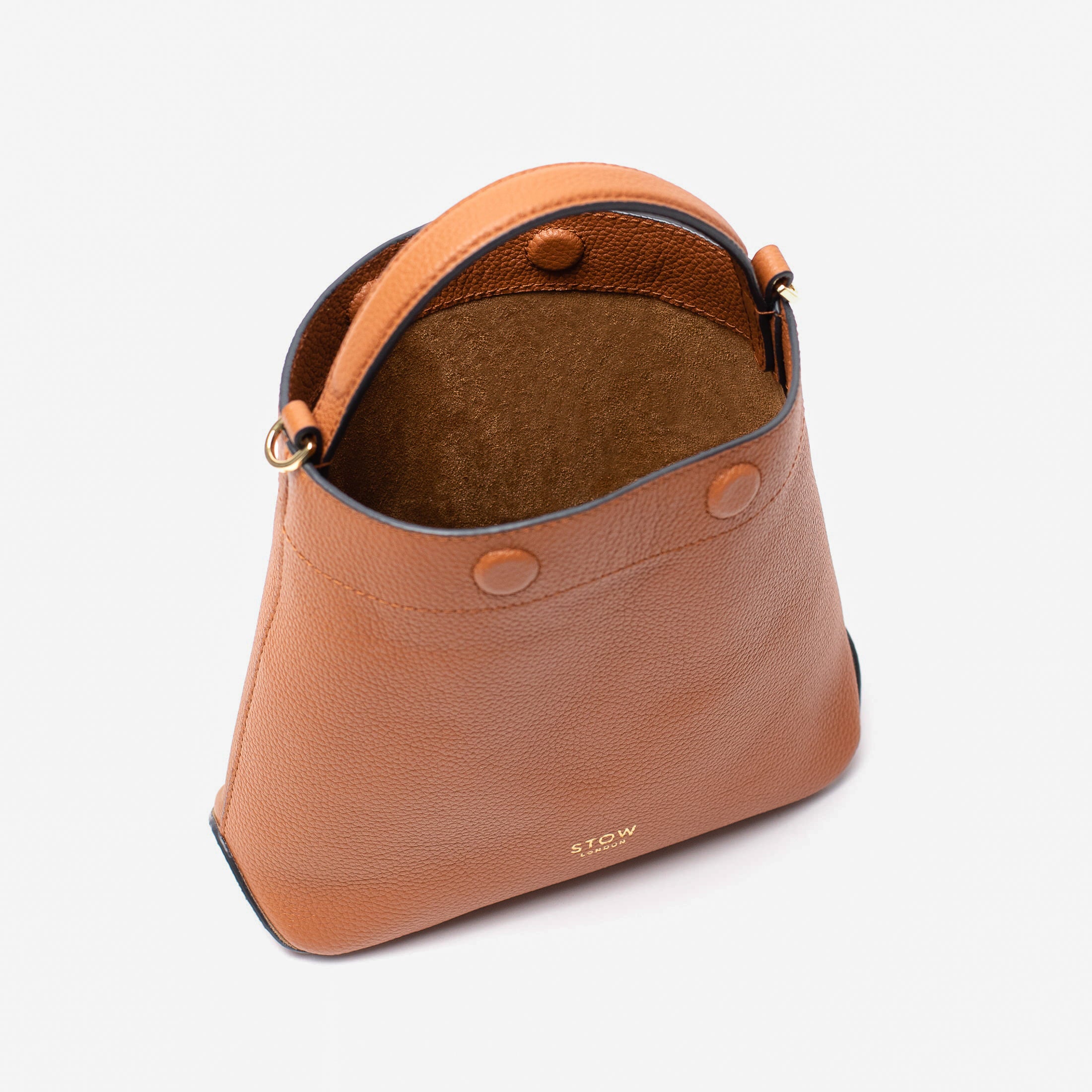 Stow London's Mini Curve in Earth tan pebbled leather with magnets open showing suede interior lining on a light grey background