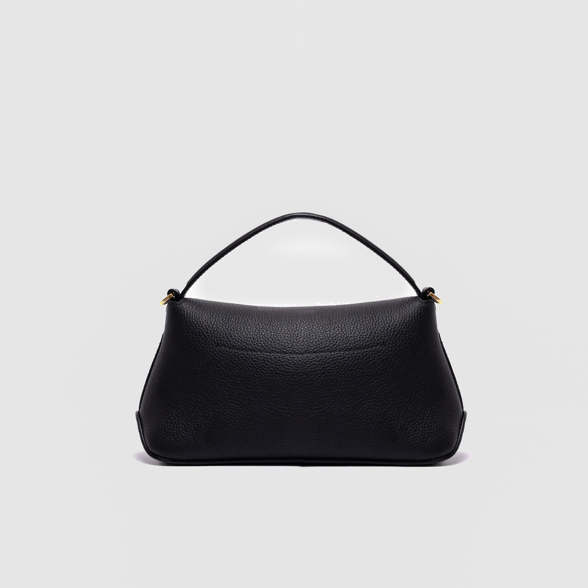 Back panel of STOW London's Mini East West in Black pebbled leather featuring gold-coated stainless steel hardware on a light grey background