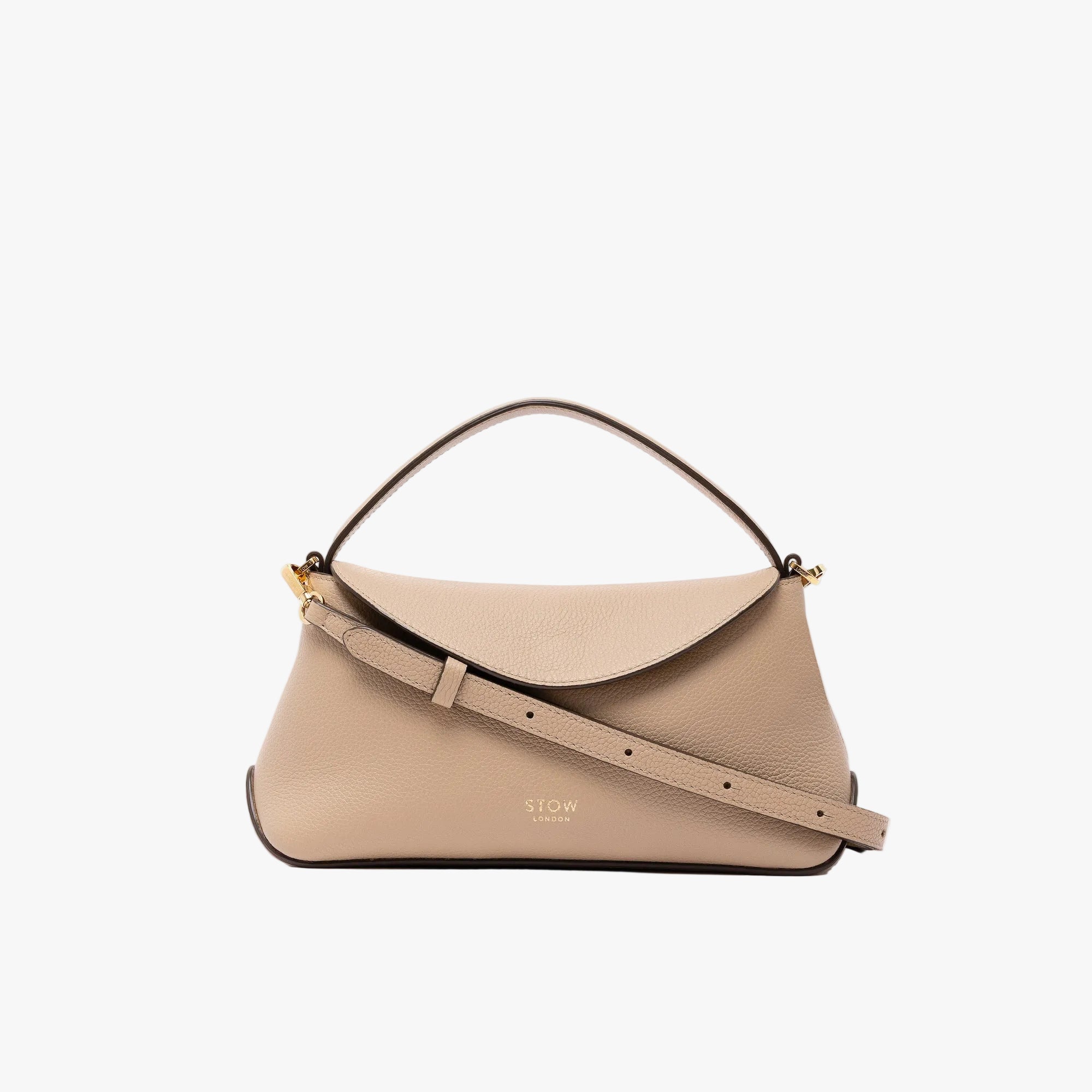 STOW London's Mini East West in Camel pebbled leather and detachable crossbody strap featuring gold-coated stainless steel hardware on a light grey background