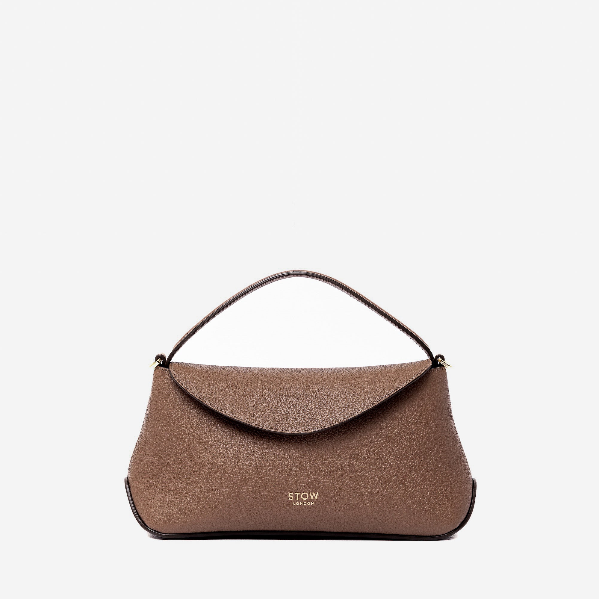 STOW London's Mini East West in Mocha pebbled leather featuring gold-coated stainless steel hardware on a light grey background
