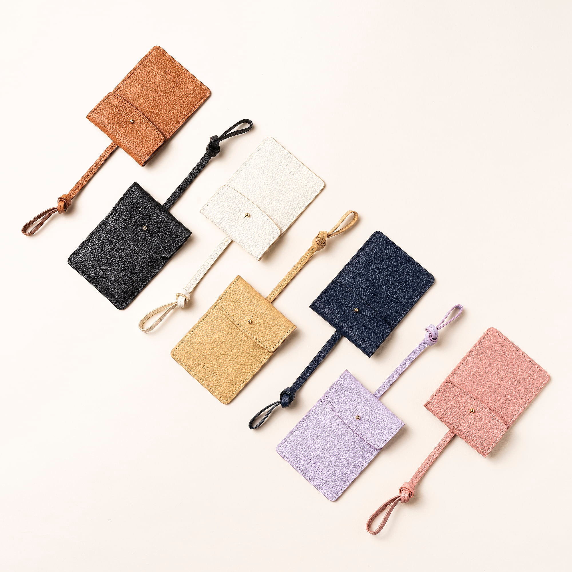 STOW London Leather Multi Tag in various colours laid out together.