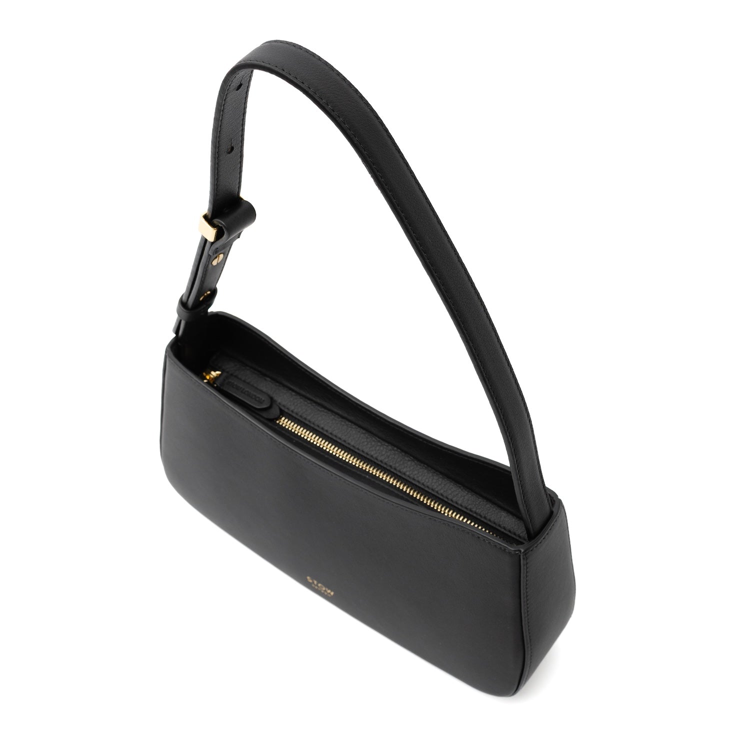 Top angled view of STOW London's Post Shoulder bag in Black smooth leather showing the zip-top closure featuring gold-coated stainless steel hardware on a white background
