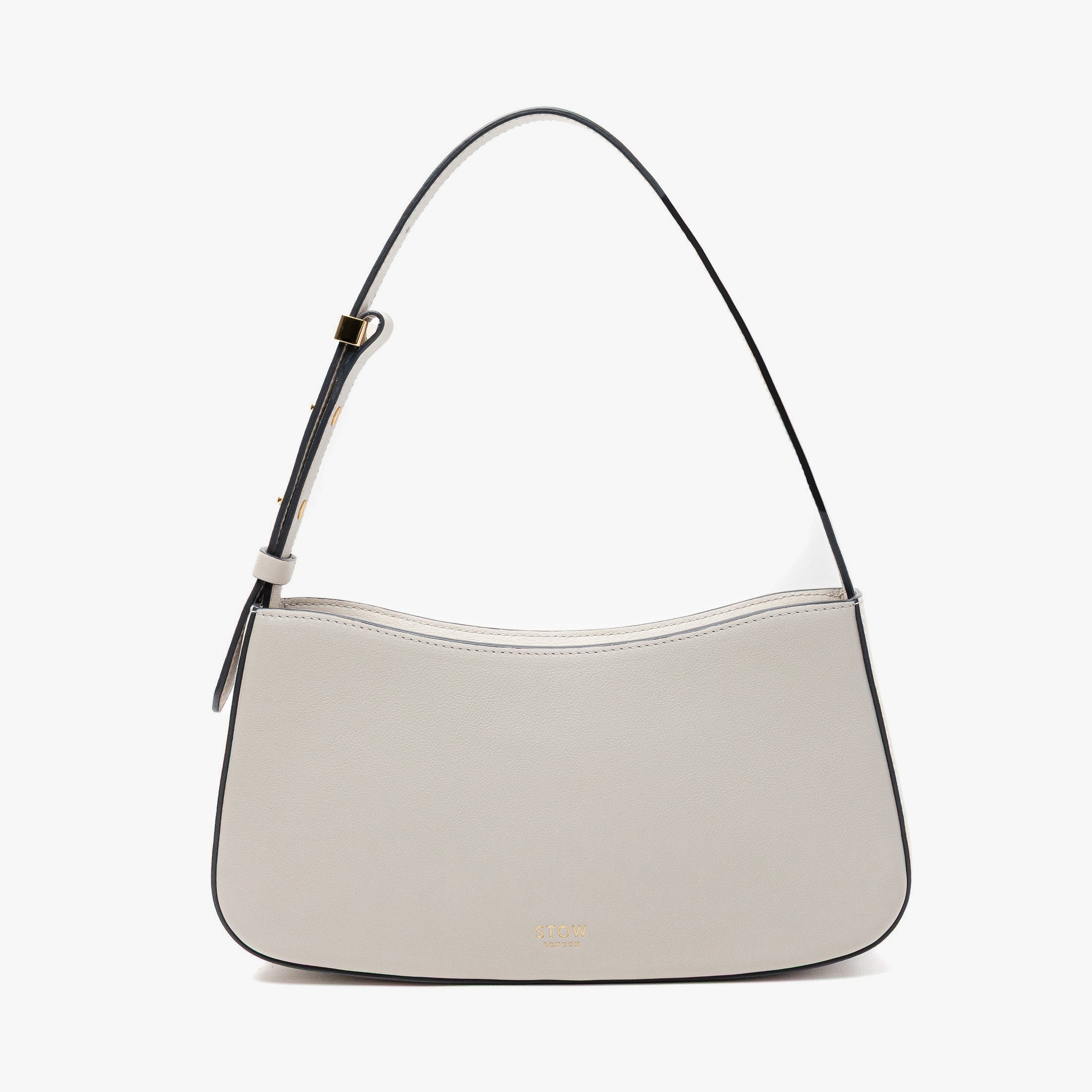 Stow London's Post Shoulder in Cloud Grey smooth leather on a light grey background featuring gold-coated stainless steel hardware