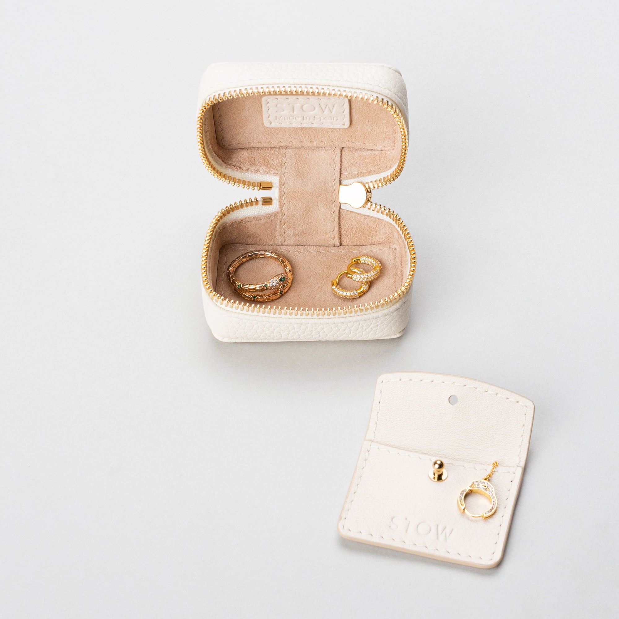 STOW London Mini Essentials Case in Spring Moon leather, showing leather sleeve included inside