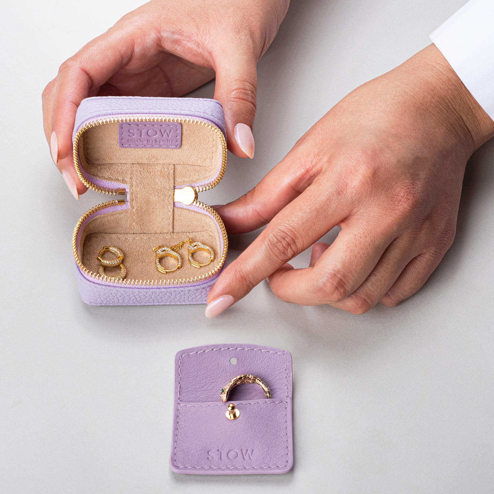 STOW London Mini Essentials Case in Wild Lavender leather, showing leather sleeve included inside
