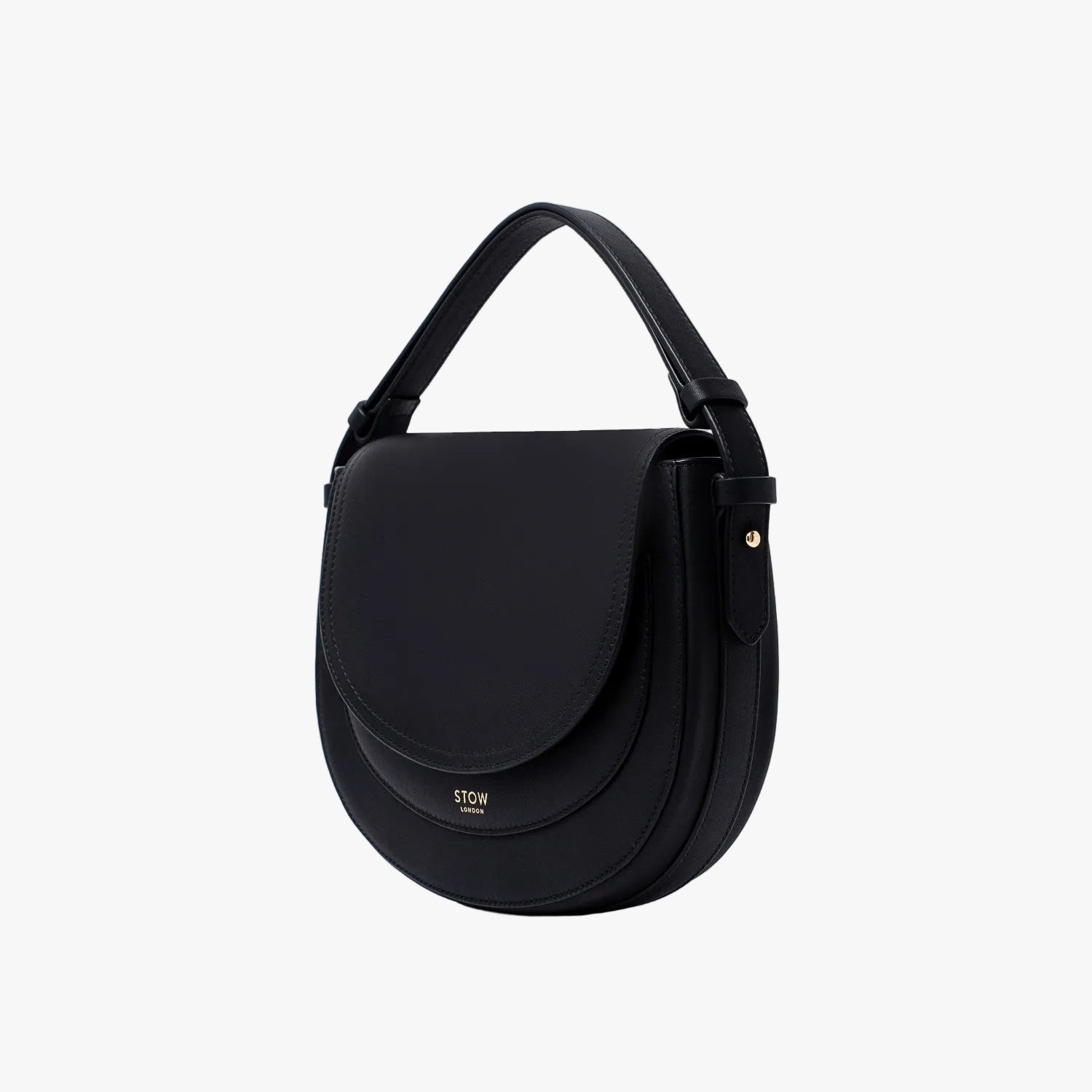 STOW London's Saddle bag in Black smooth leather with its short top handle on a light grey background