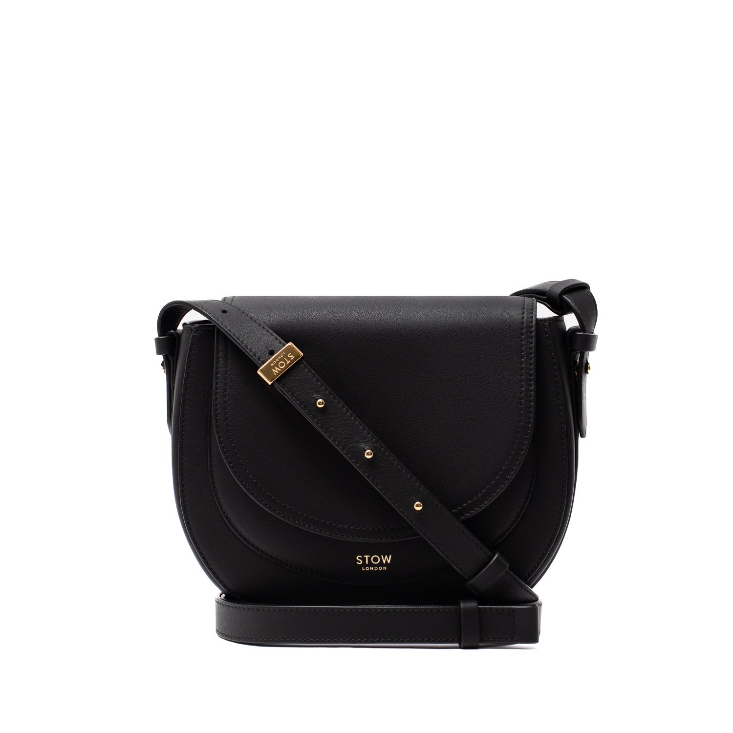 STOW London's Saddle bag in Black smooth leather and detachable, adjustable crossbody strap featuring gold-coated stainless steel hardware on a white background