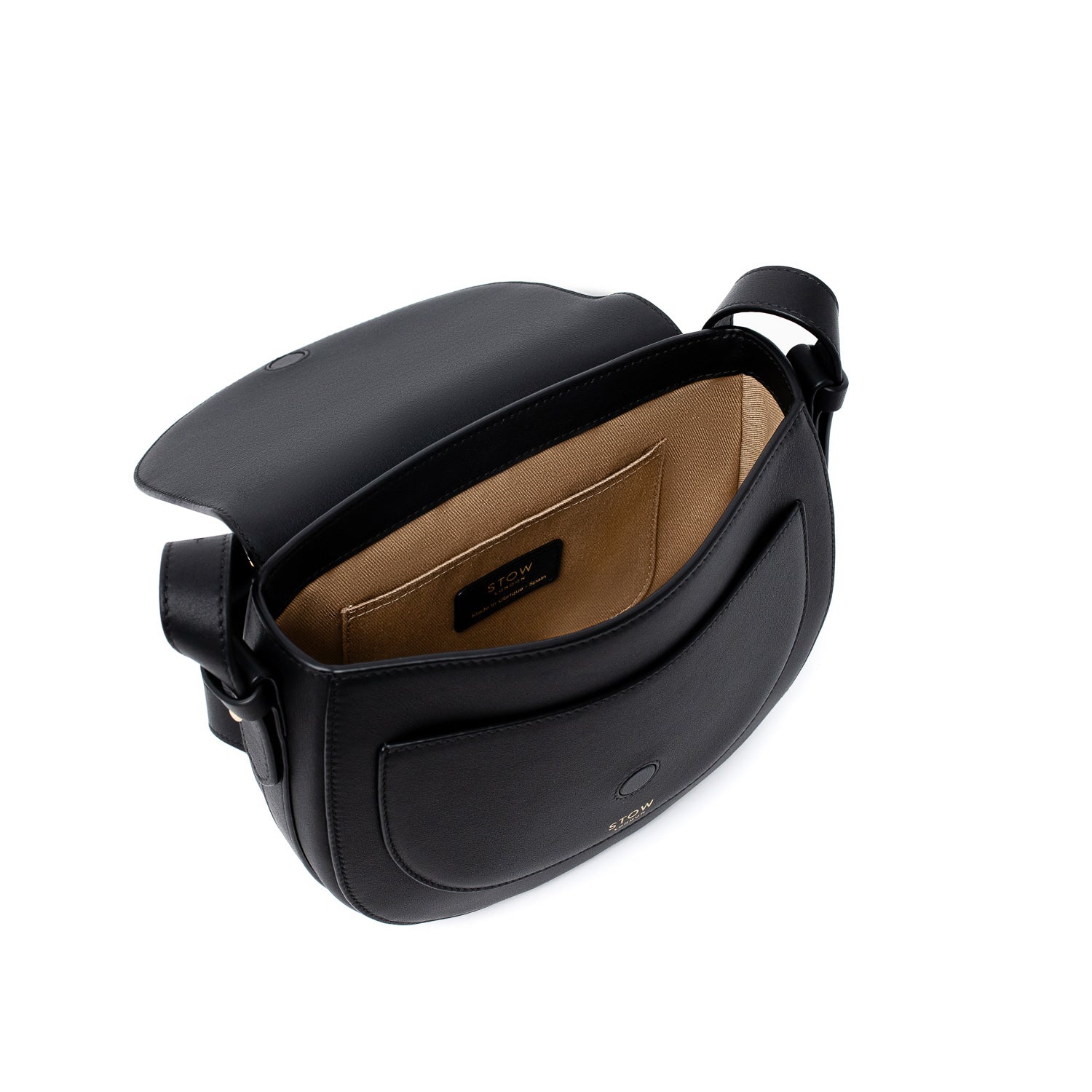 Top angled view of STOW London's Saddle bag in Black smooth leather with flap open showing interior cotton lining and card holder pocket featuring gold-coated stainless steel hardware and clean magnetic closures on a white background