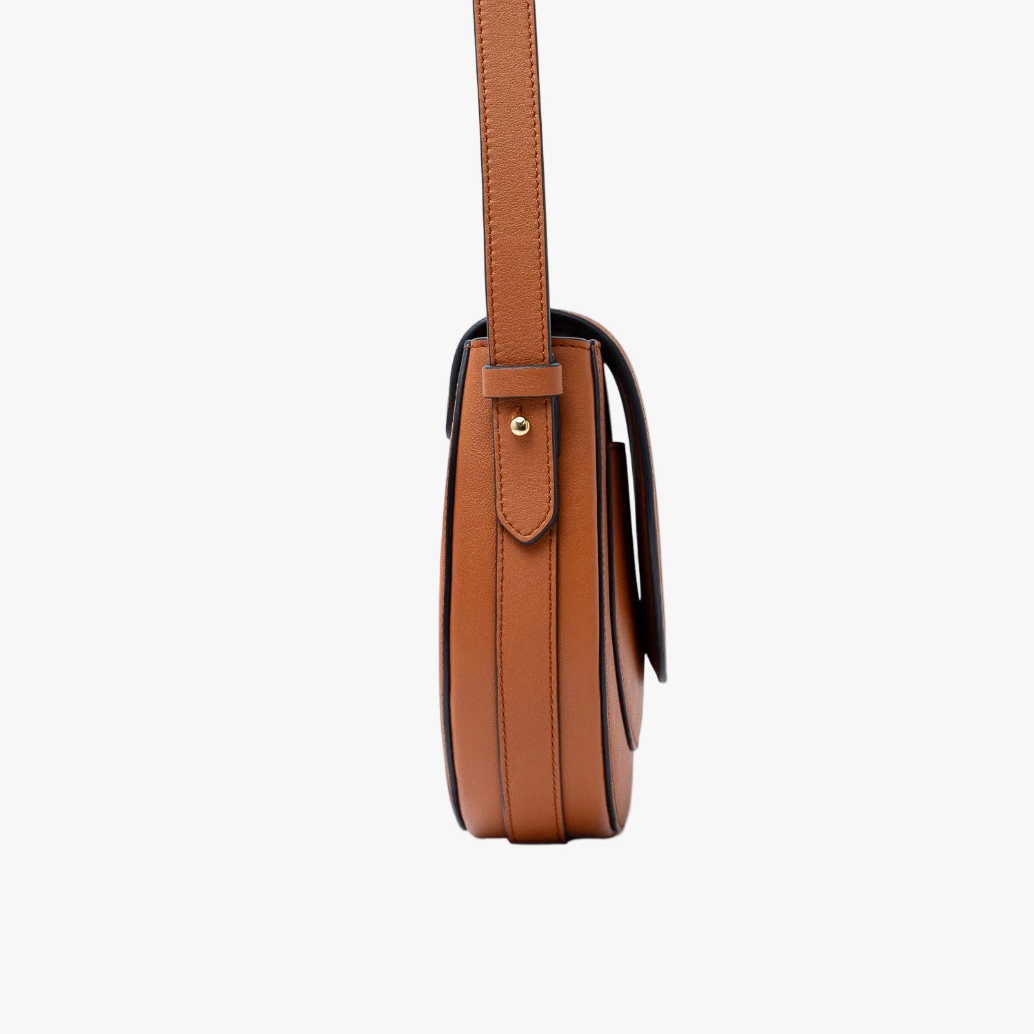 Side view of STOW London's Saddle bag in Earth Tan smooth leather on a light grey background