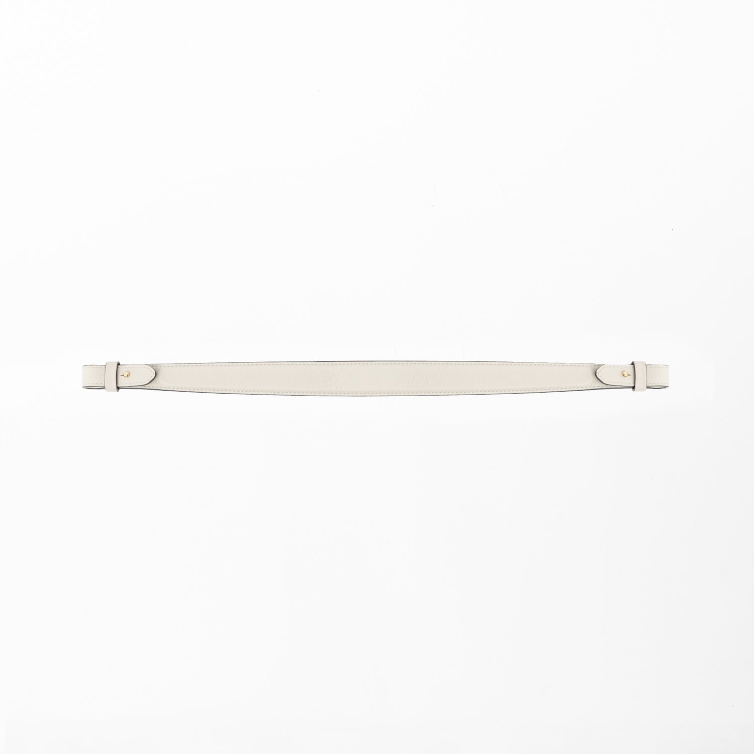 Detachable shoulder strap for STOW London's Curve, Midi Curve and East West in Cloud Grey smooth leather on a light grey background featuring gold hardware