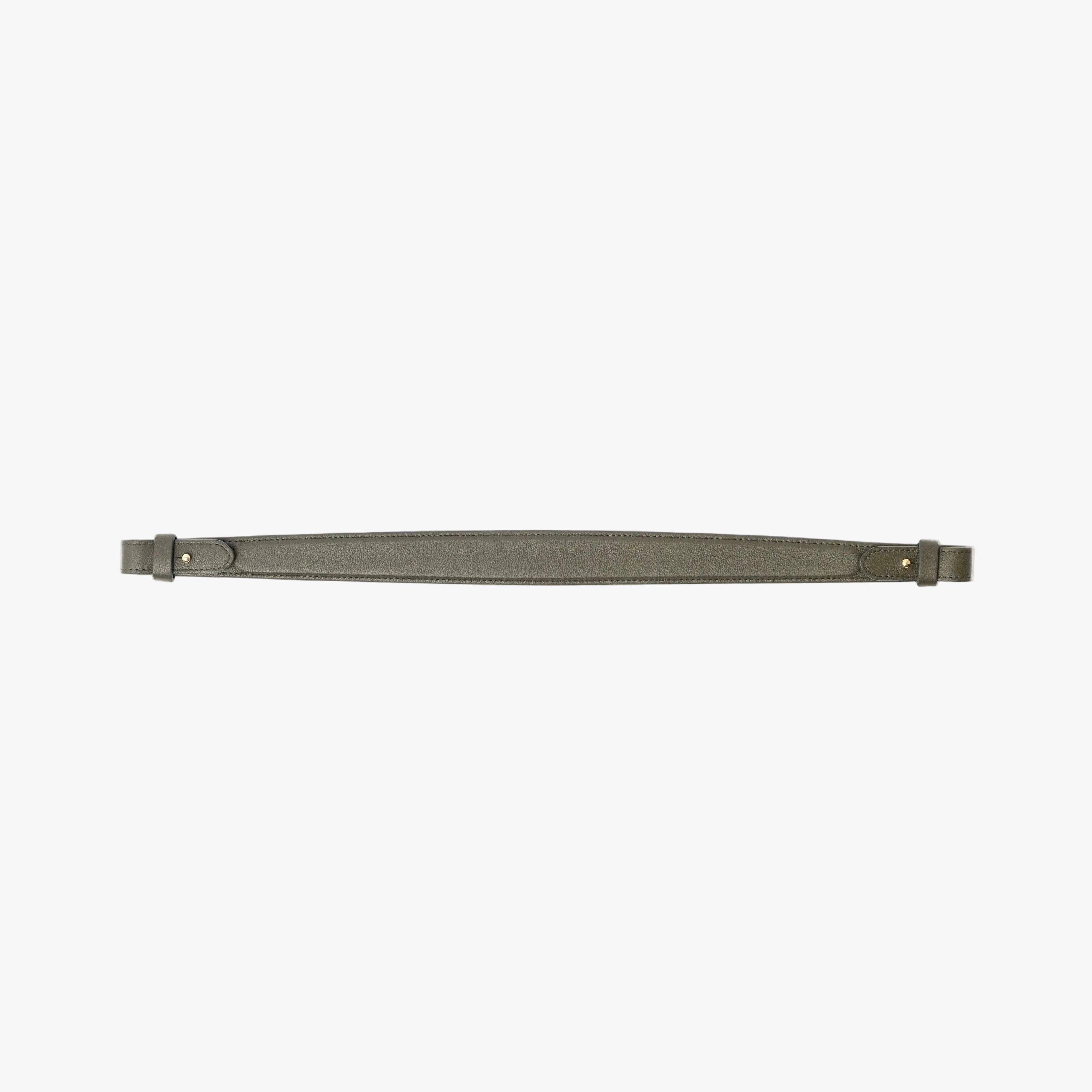 Detachable shoulder strap for STOW London's Curve, Midi Curve and East West in Dark Green smooth leather on a light grey background featuring gold hardware