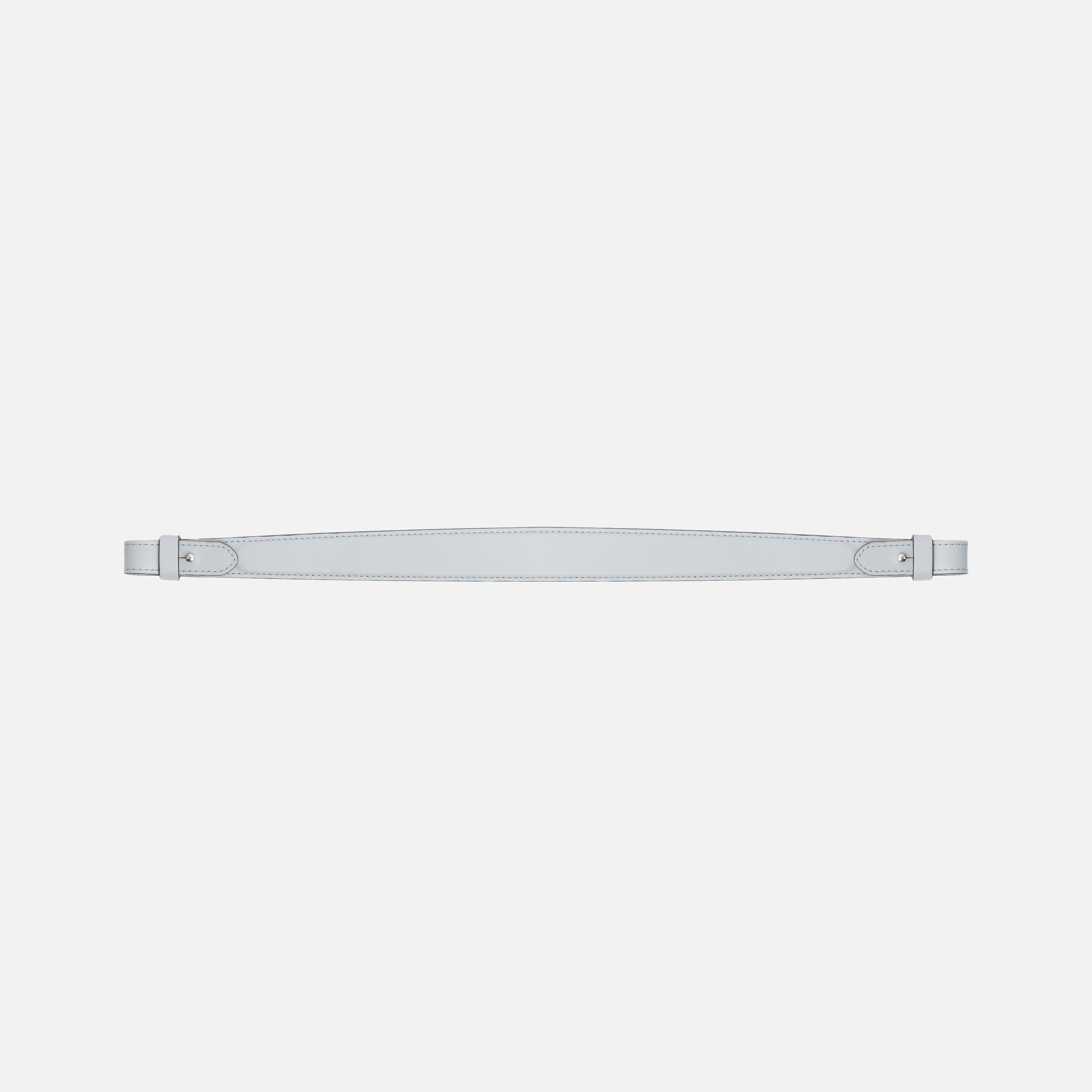 Detachable shoulder strap for STOW London's Curve, Midi Curve and East West in Misty Blue smooth leather on a light grey background featuring gold hardware