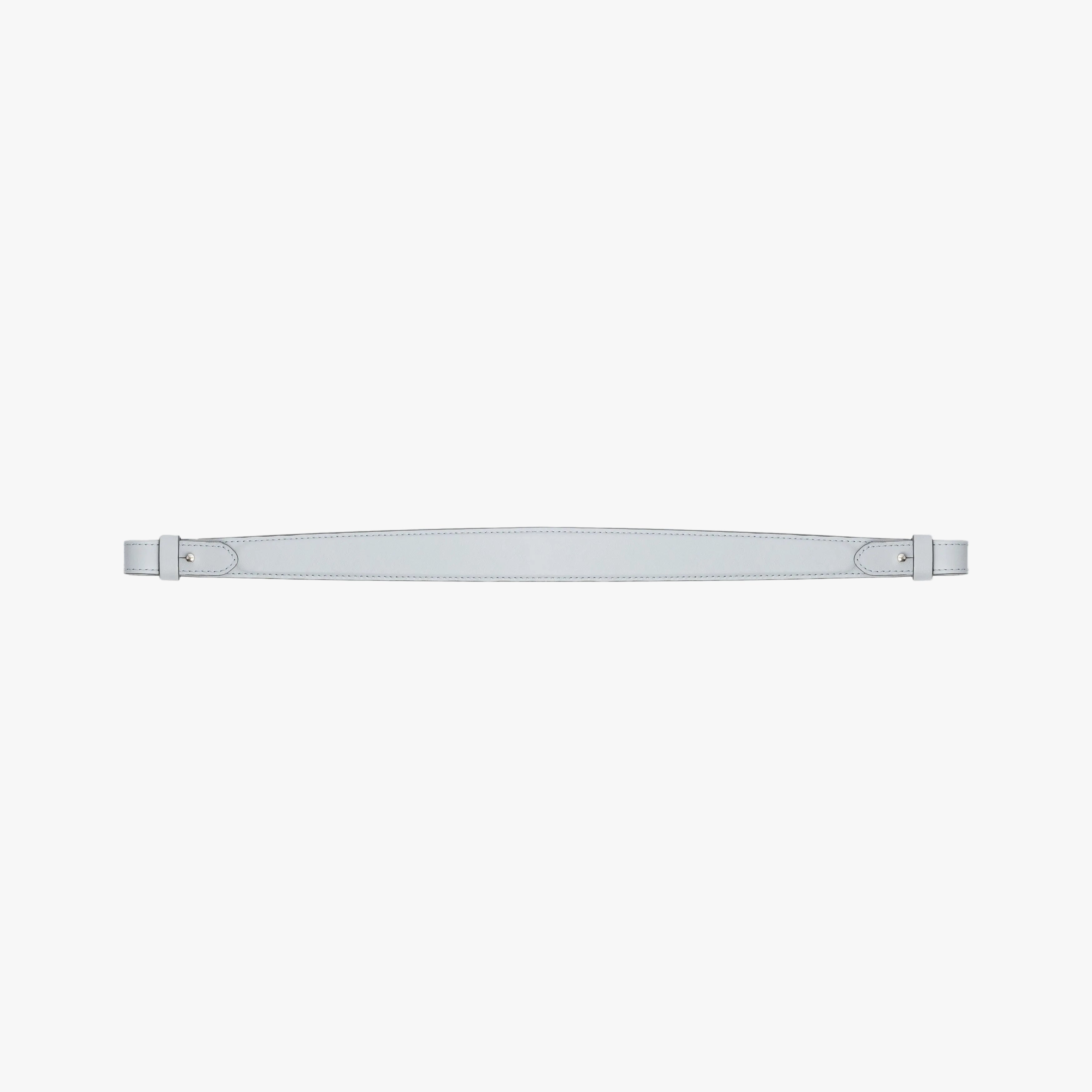 Detachable shoulder strap for STOW London's Curve, Midi Curve and East West in Misty Blue smooth leather on a light grey background featuring gold hardware