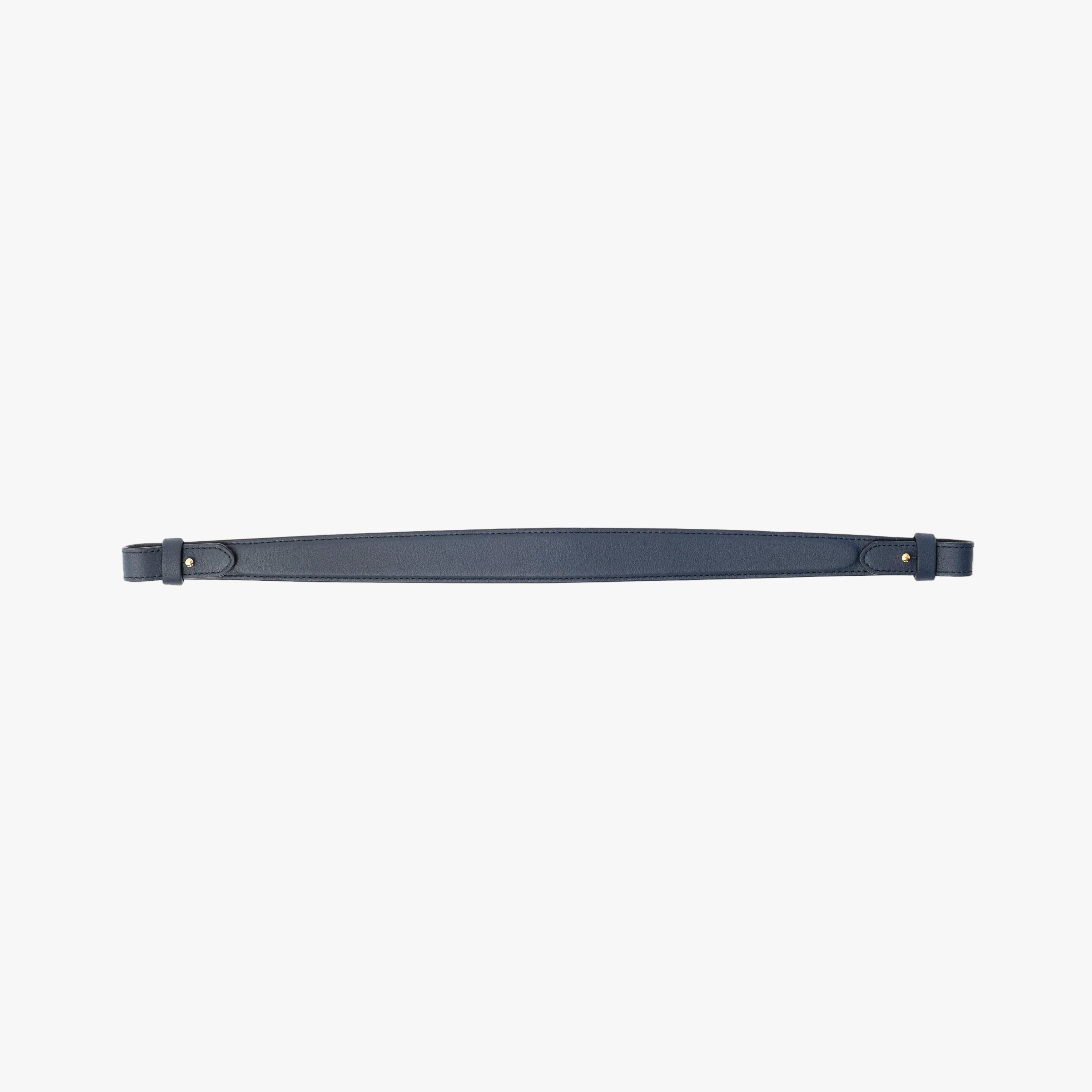 Detachable shoulder strap for STOW London's Curve, Midi Curve and East West in Navy smooth leather on a light grey background featuring gold hardware