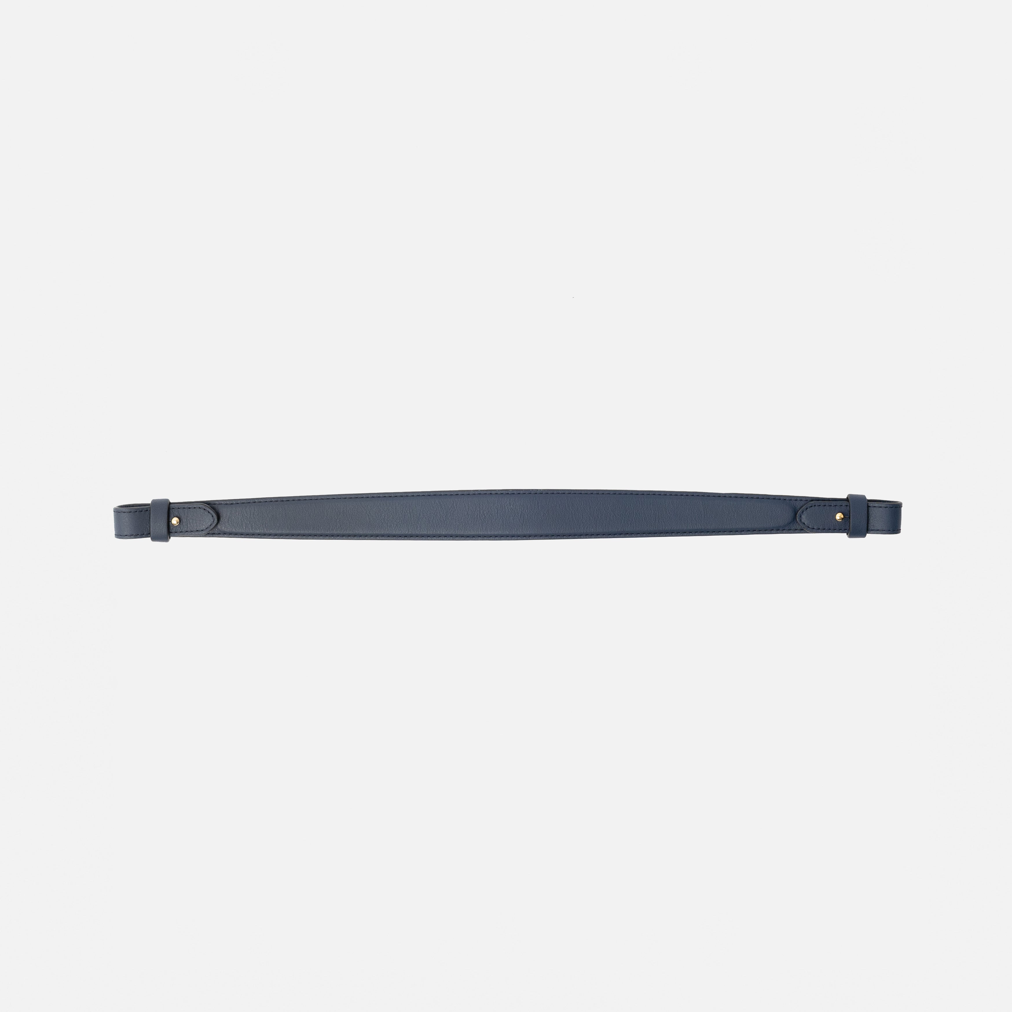 Detachable shoulder strap for STOW London's Curve, Midi Curve and East West in Navy smooth leather on a light grey background featuring gold hardware