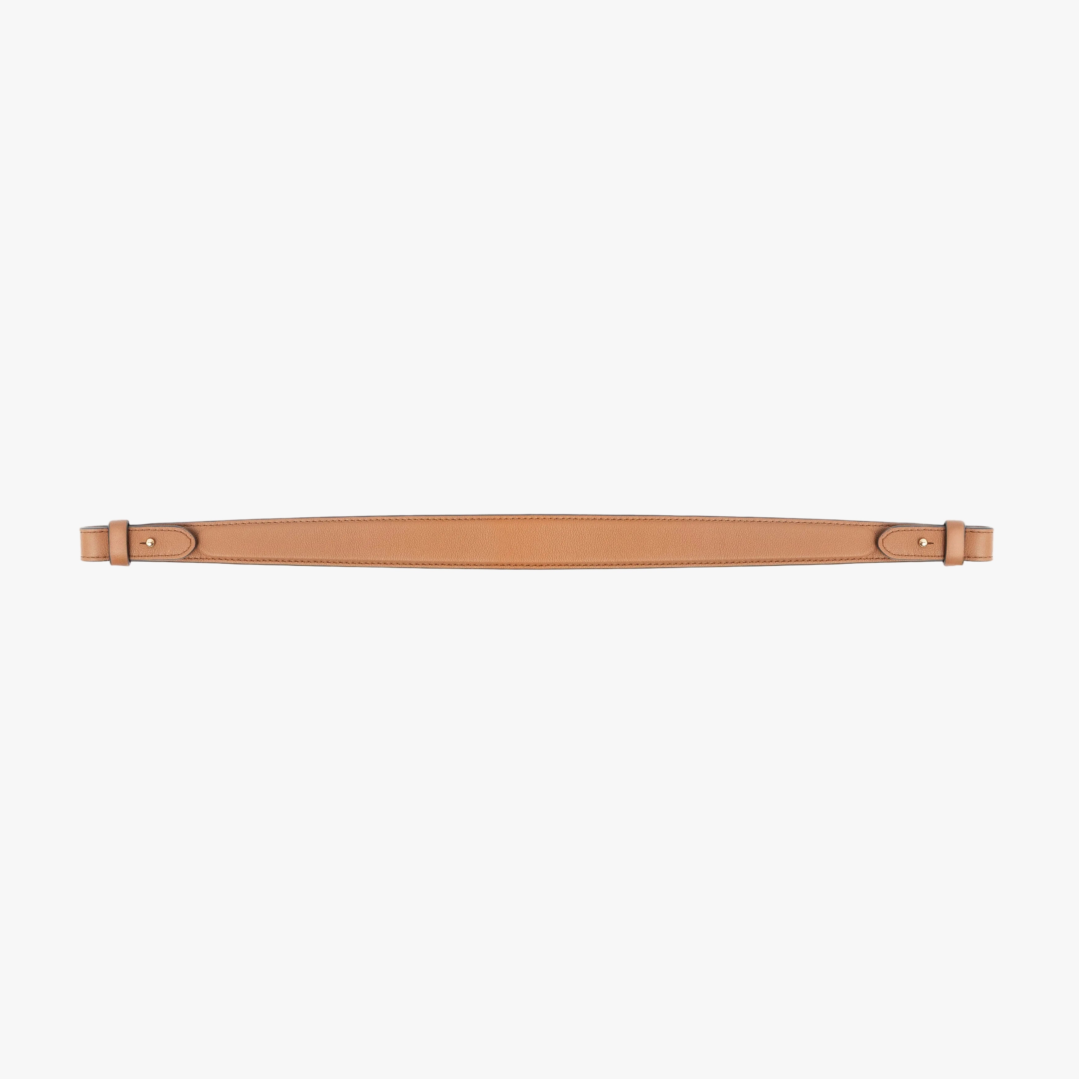 Detachable shoulder strap for STOW London's Curve, Midi Curve and East West in Earth Tan smooth leather on a light grey background featuring gold hardware