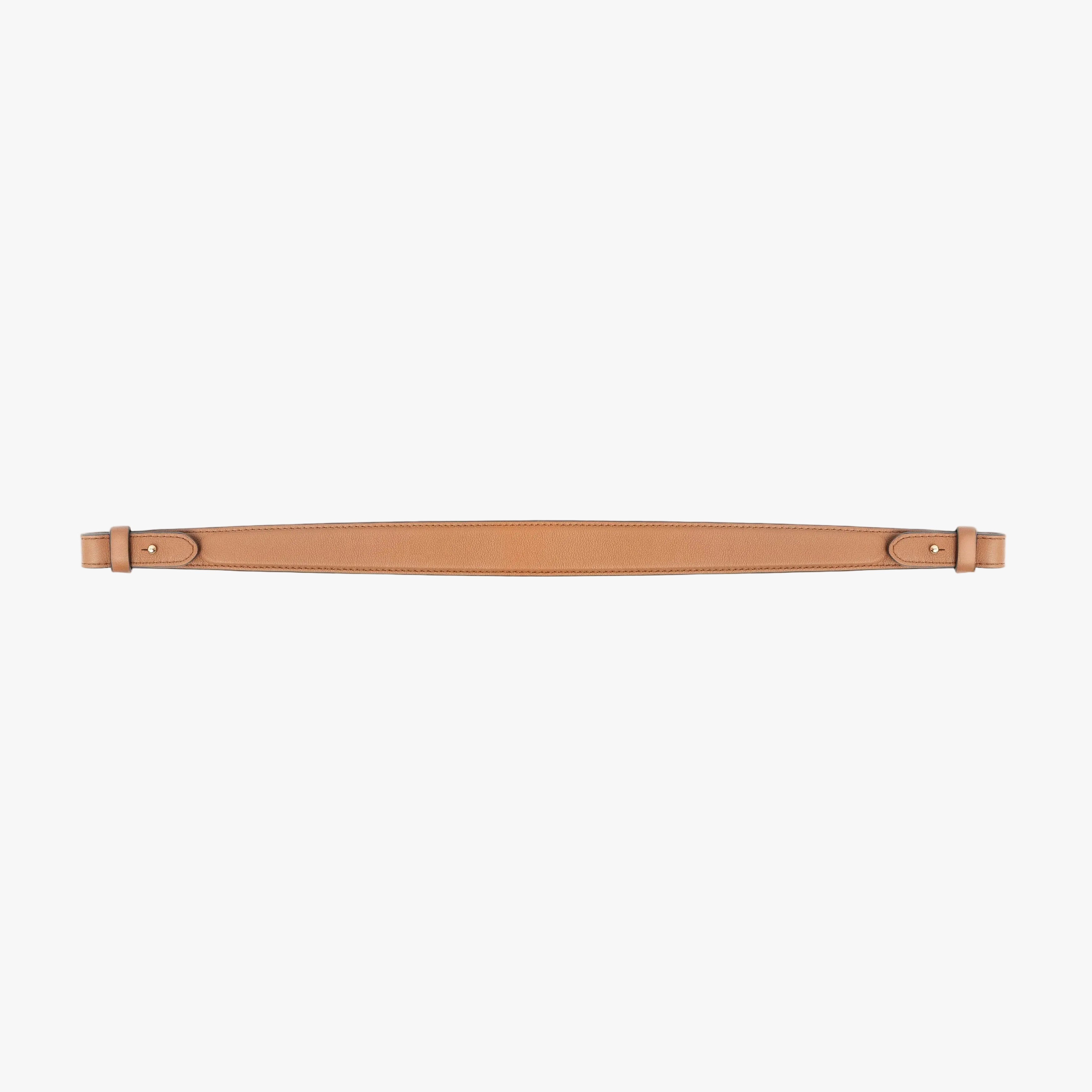 Detachable shoulder strap for STOW London's Curve, Midi Curve and East West in Earth Tan smooth leather on a light grey background featuring gold hardware