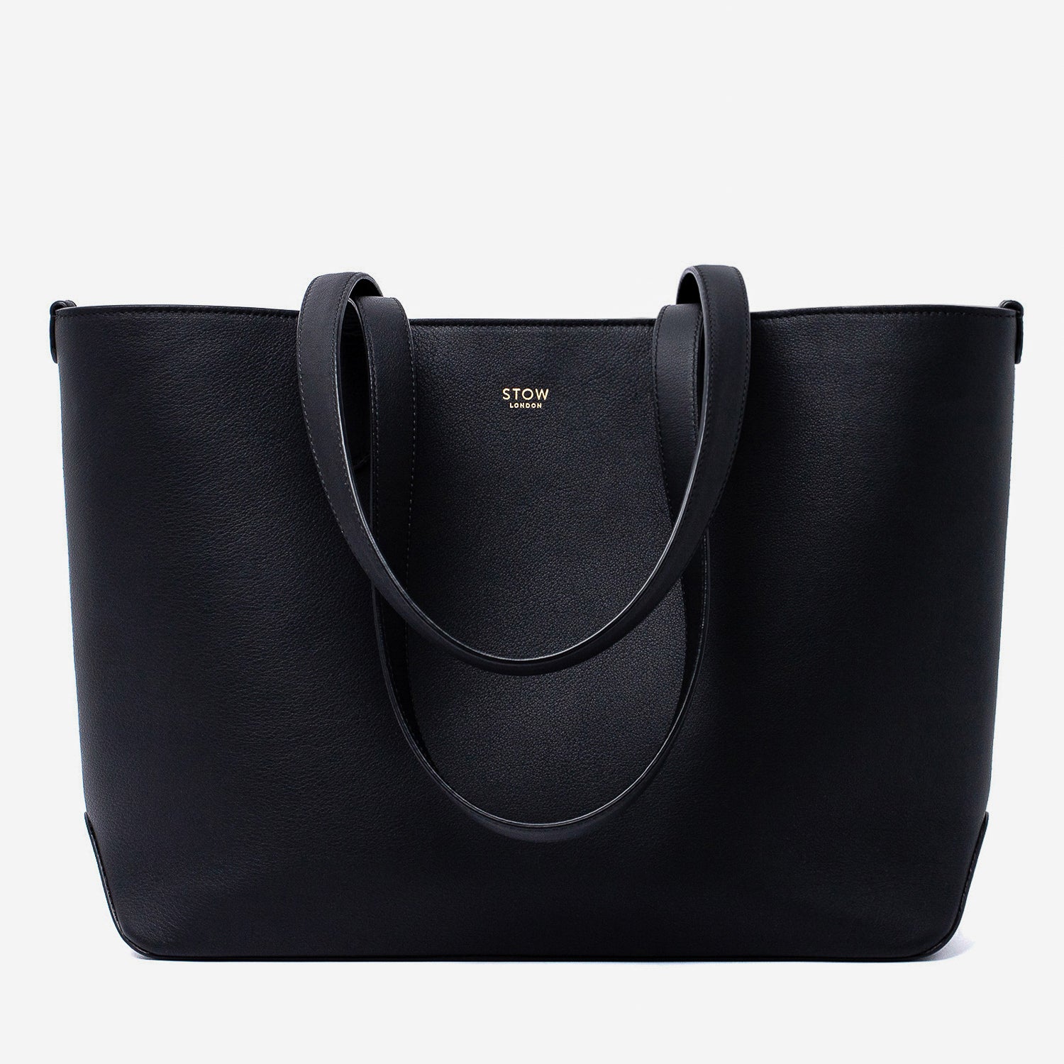 Stow London's Everyday Tote Bag in Black smooth leather on a light grey background featuring gold STOW logo