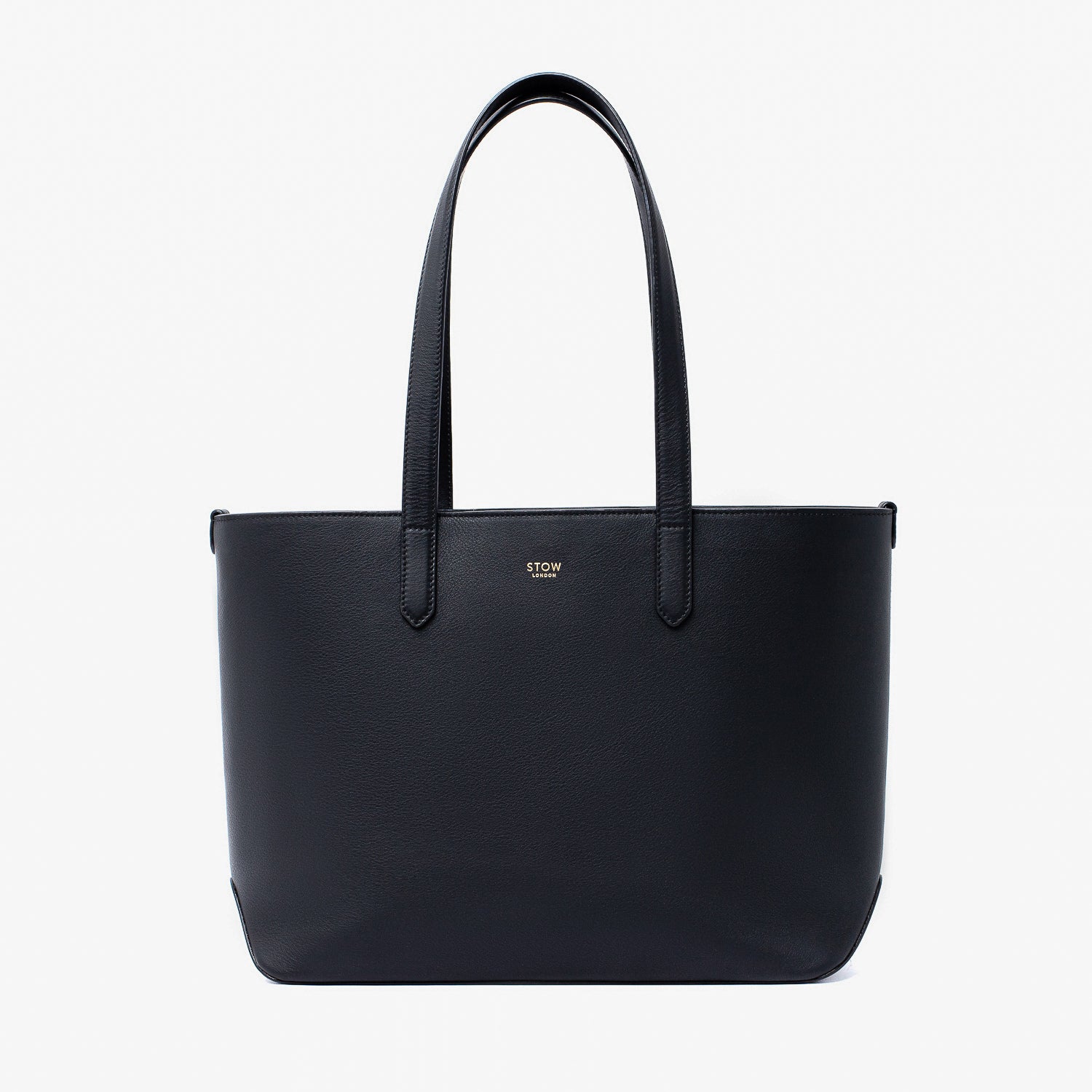 Stow London's Everyday Tote Bag in Black smooth leather on a light grey background featuring gold STOW logo