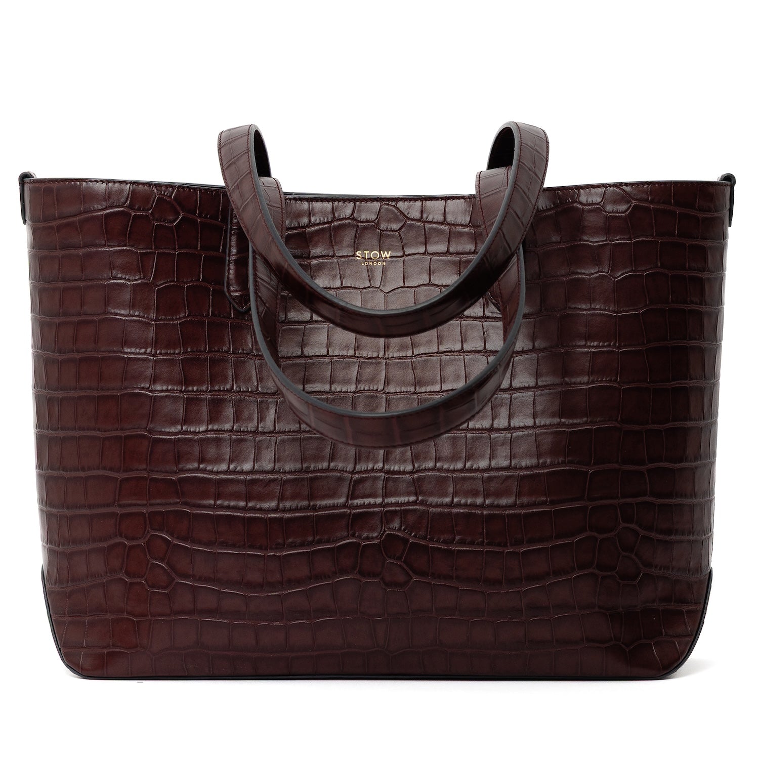 Stow London's Everyday Tote Bag in Burgundy Embossed Croc leather on a white background with straps down and gold embossed logo
