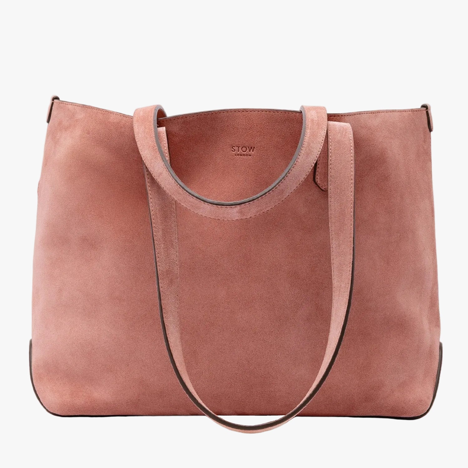 STOW London's Everyday Tote bag in Hazy Blush suede on a light grey background featuring a small STOW London logo embossed on the front panel