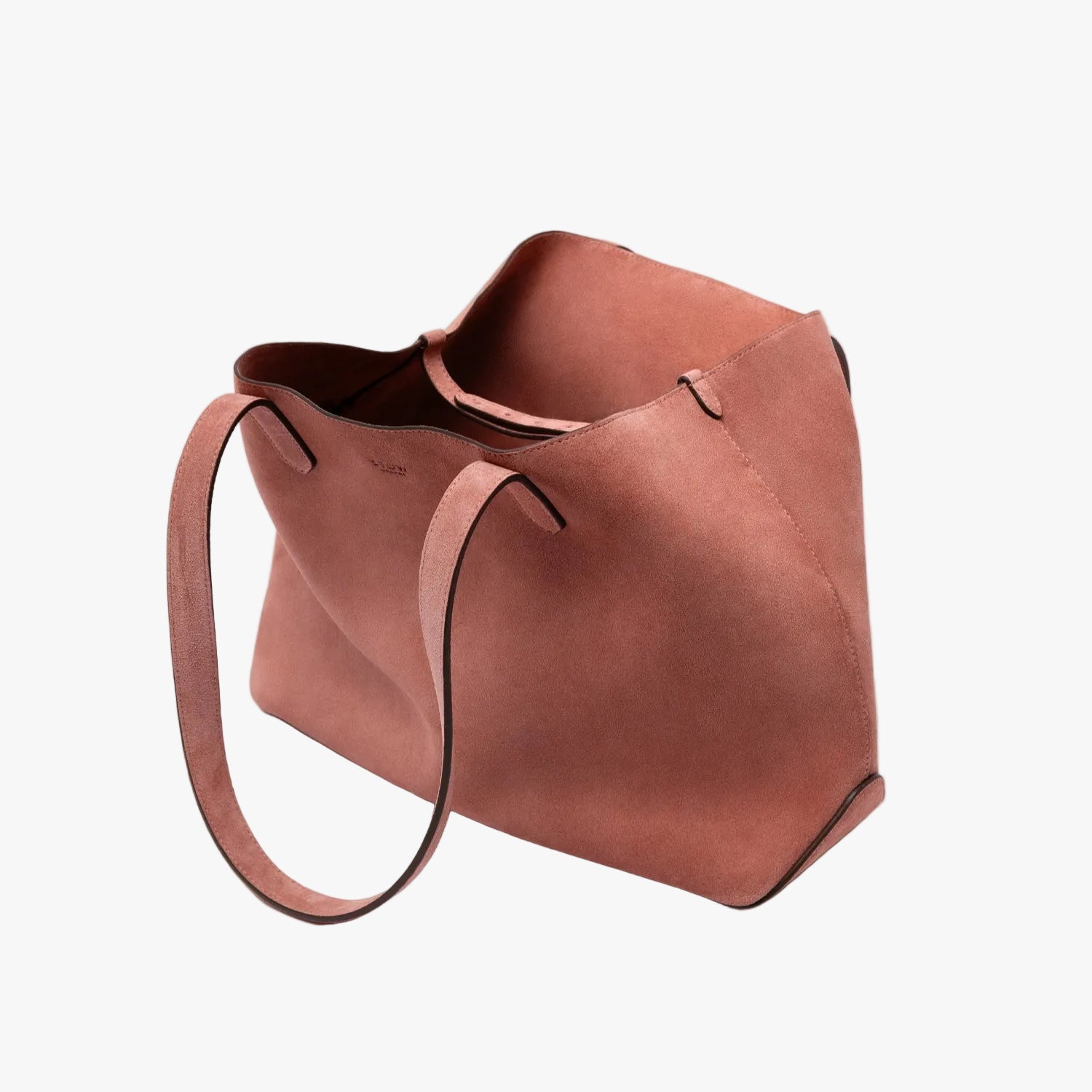 STOW London's Everyday Tote bag in Hazy Blush suede on a light grey background featuring the interior strap and a small STOW London logo embossed on the front panel