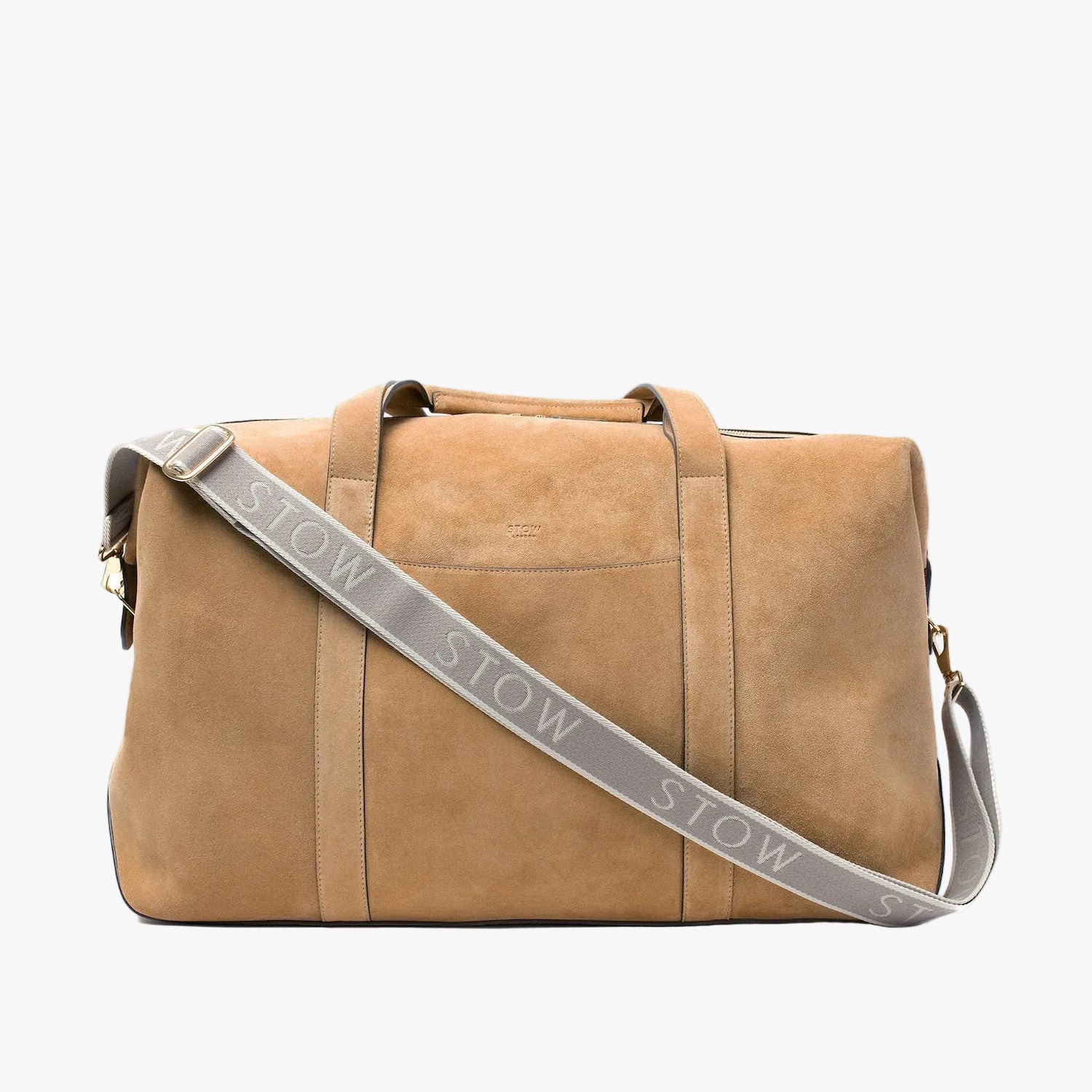 STOW London's Weekend bag in Soft Sand suede featuring the detachable nastro crossbody strap on a light grey background