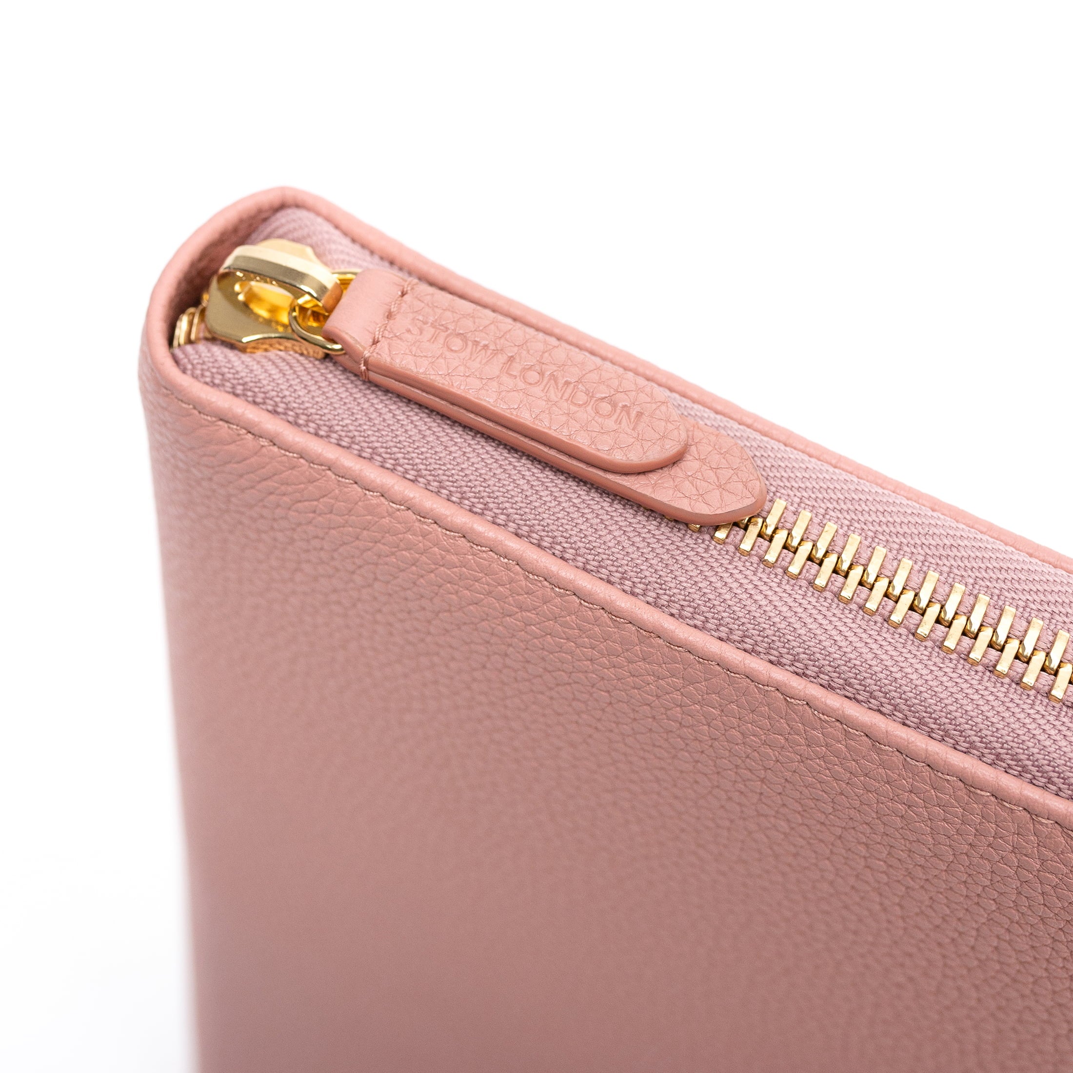 STOW London World Class Folio in Hazy Blush leather showing detail of leather zip pull.