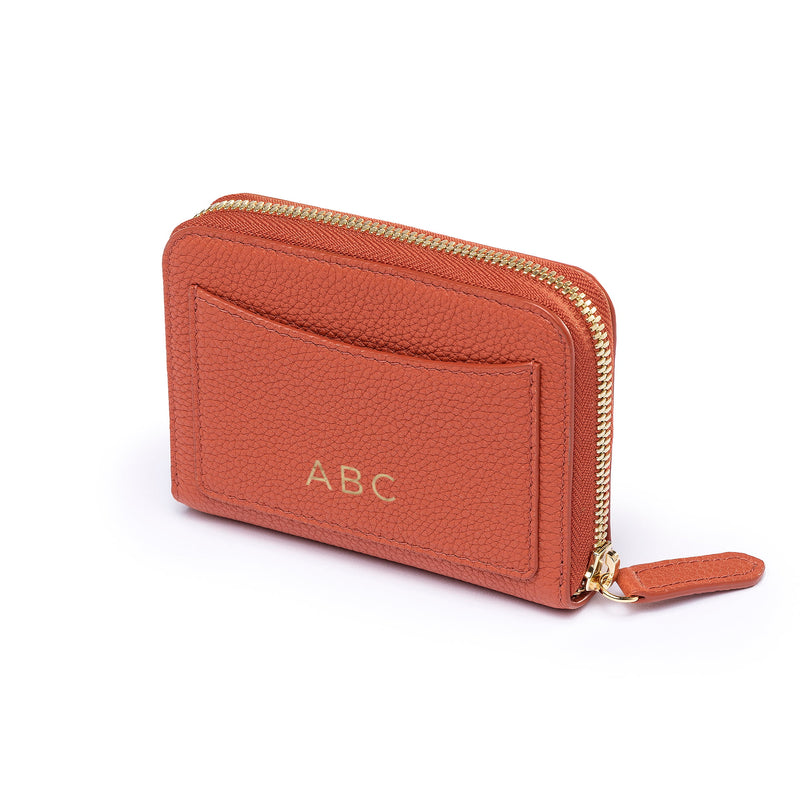 STOW Leather Zip Wallet in Clay Orange pebbled leather with personalised initials on back.