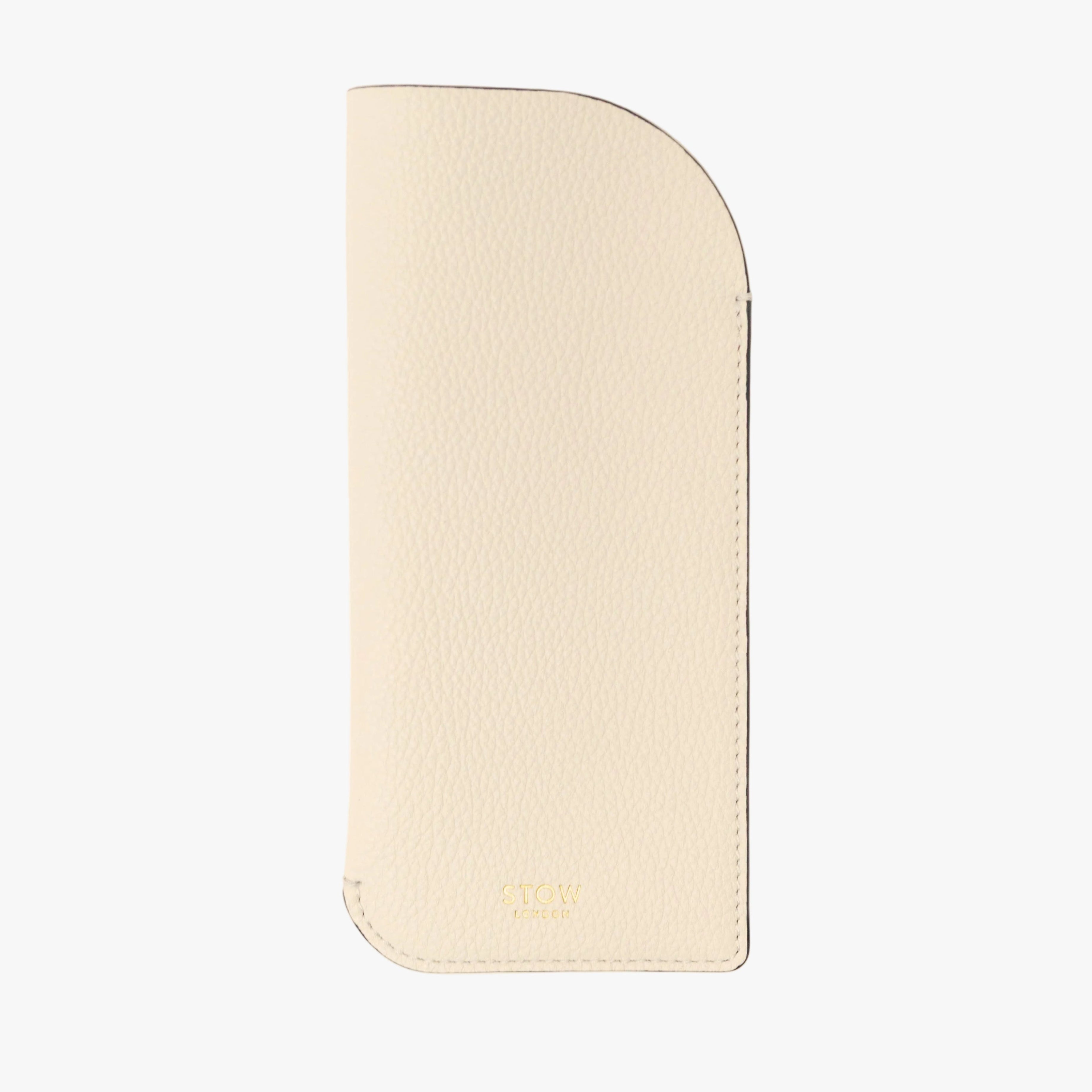 STOW London's Glasses Case in Spring Moon pebbled leather on a light grey background featuring a small gold embossed logo at the bottom 