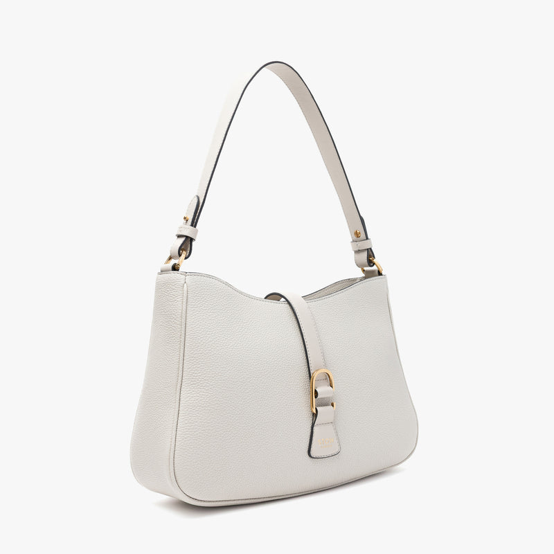 Off-axis view of STOW London's Beth bag in Cloud Grey pebbled and smooth leather featuring gold-coated stainless steel hardware and clip on a white background
