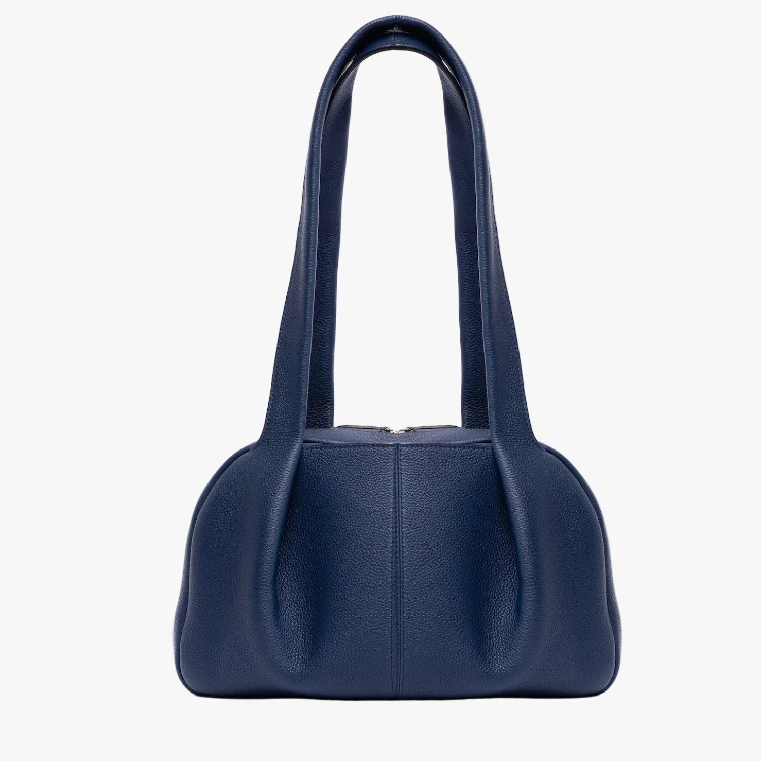 STOW London's Bowling bag in Navy pebbled leather featuring the pleated front panel and gold-coated stainless steel hardware on a light grey background