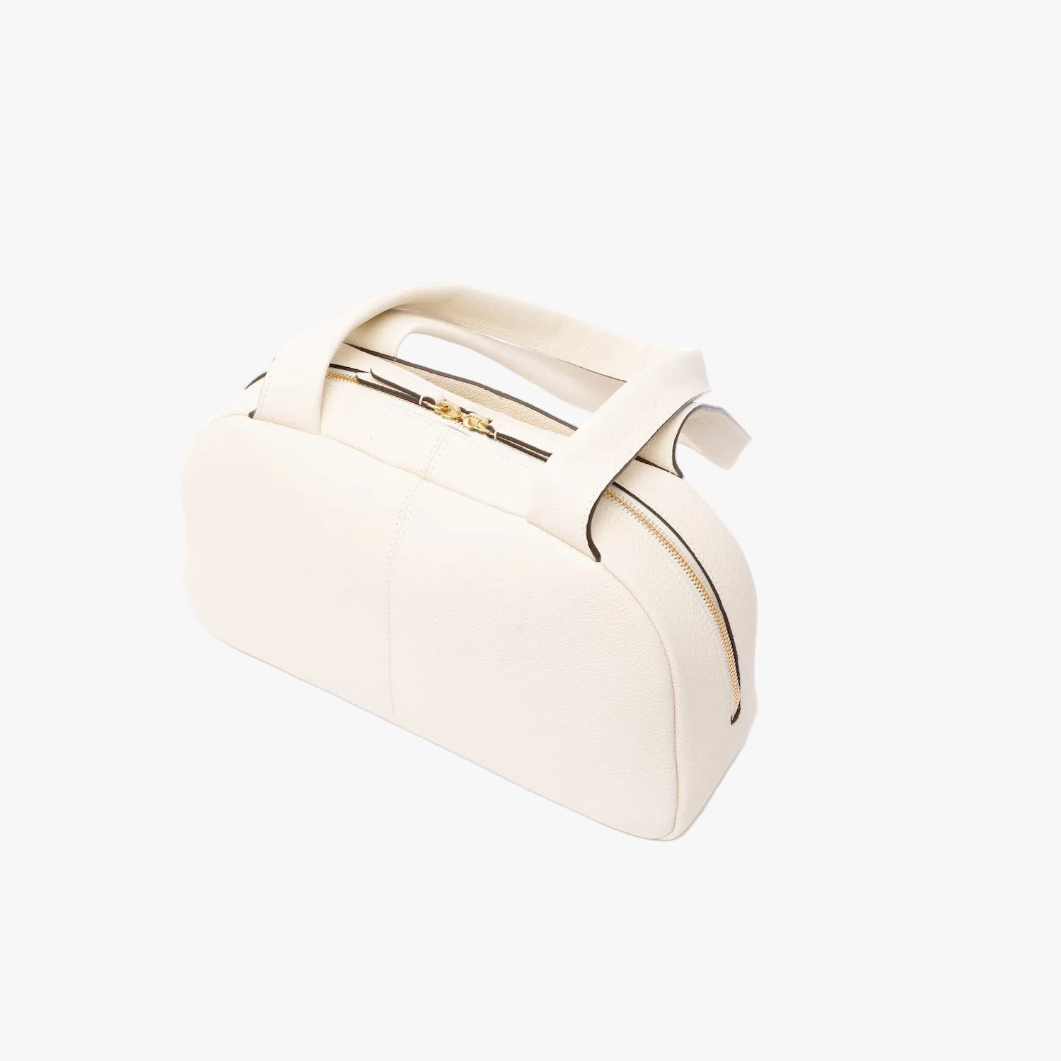 Top view of the back of STOW London's Bowling bag in Spring Moon pebbled leather featuring gold-coated stainless steel hardware on a light grey background
