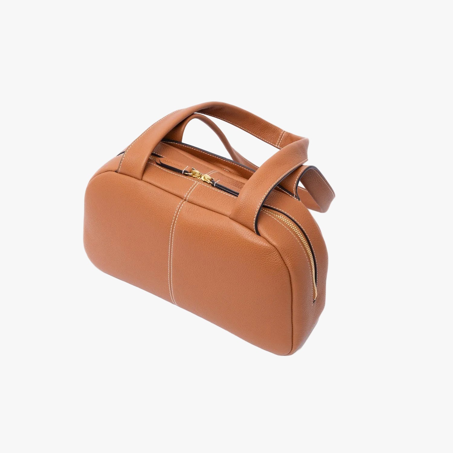Top view of the back of STOW London's Bowling bag in Earth Tan pebbled leather featuring gold-coated stainless steel hardware on a light grey background