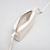 Spring Moon cream leather Camera Bag by STOW, studio image showing inside of bag.