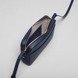 Navy leather Camera Bag by STOW, studio image showing inside of bag.