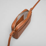 Earth Tan leather Camera Bag by STOW, studio image showing inside of bag.