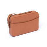 Earth Tan leather Camera Bag by STOW, studio image showing bag diagonally with crossbody strap.
