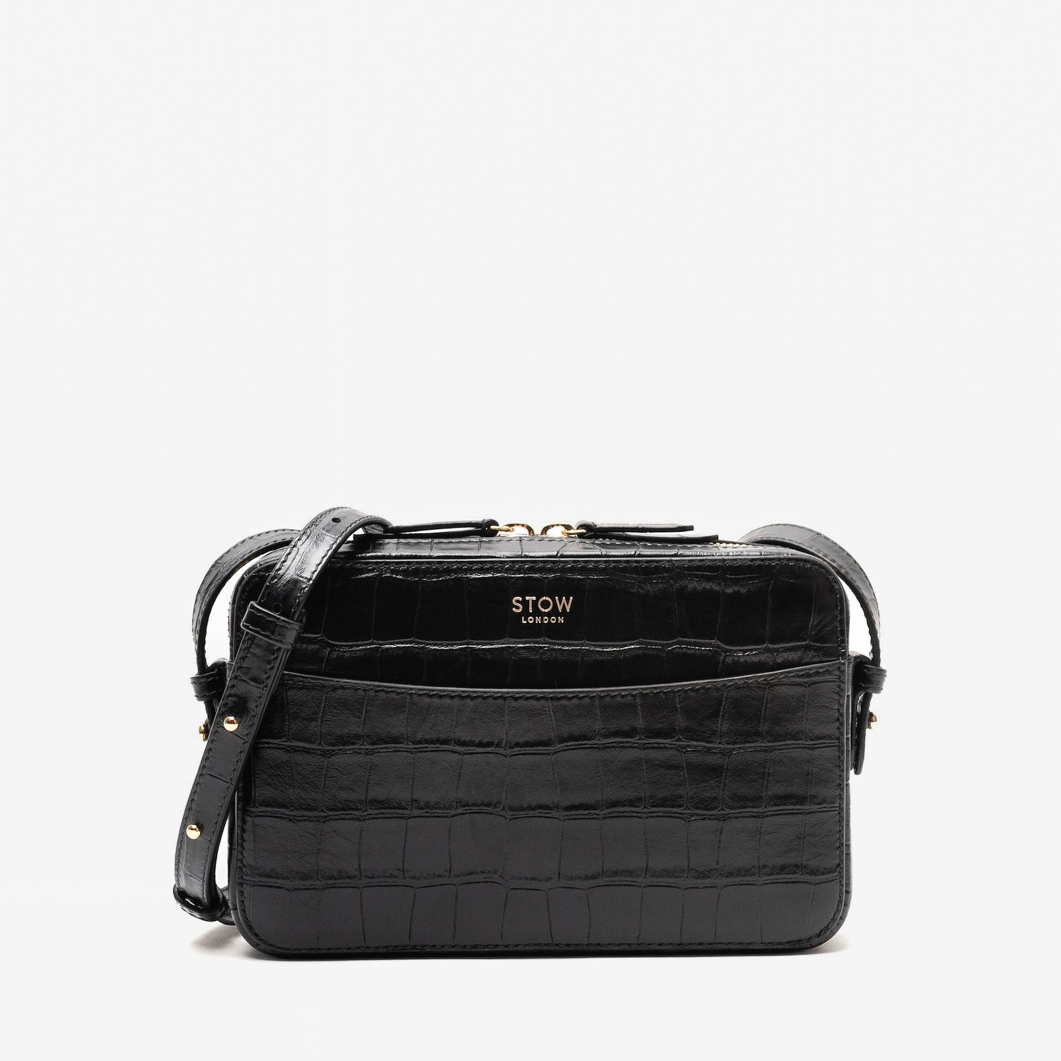 STOW London's Camera bag in Black Embossed Croc leather with detachable crossbody strap featuring gold-coated stainless steel hardware on a white background