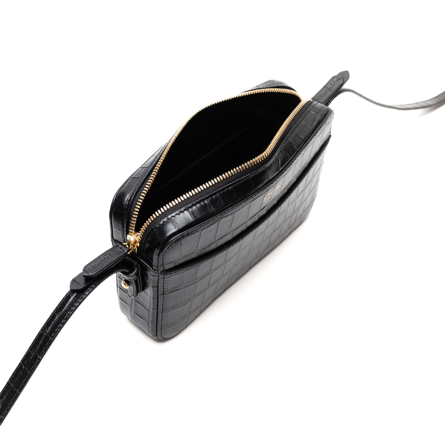 Top angled view of STOW London's Camera bag in Black Embossed Croc leather with zipper open featuring gold-coated stainless steel hardware on a white background