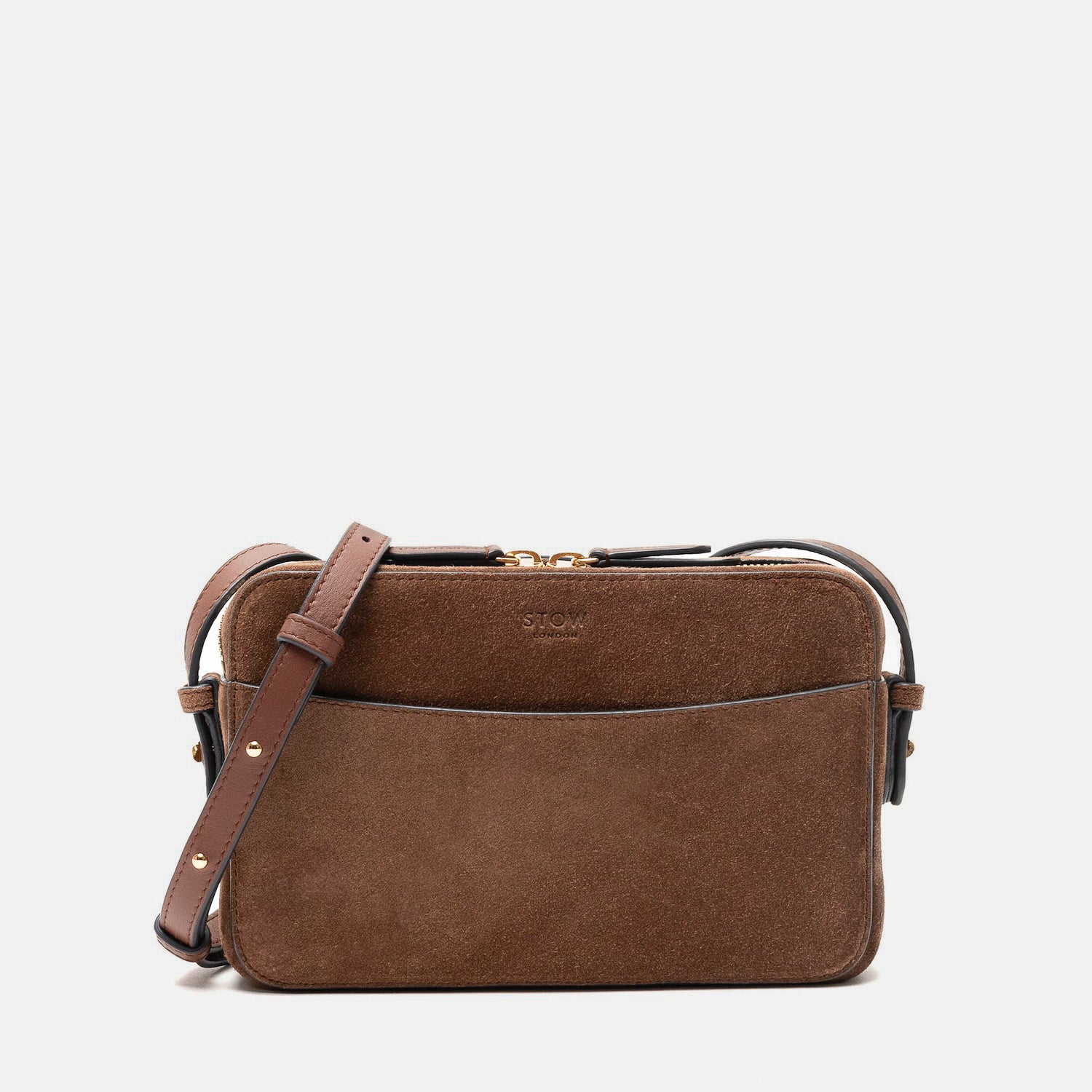 STOW London's Camera bag in Chocolate Suede leather with detachable crossbody strap featuring gold-coated stainless steel hardware on a white background