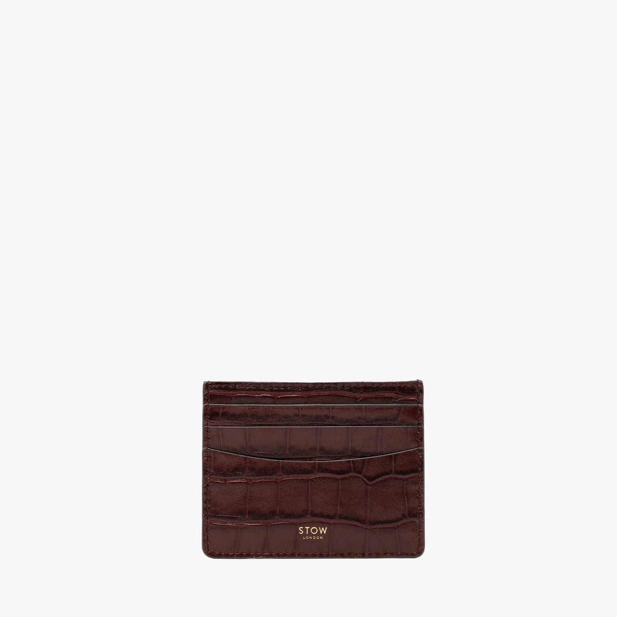 STOW London's Cardholder in Burgundy Embossed Croc leather on a light grey background featuring a fine gold embossed logo on the front bottom. 