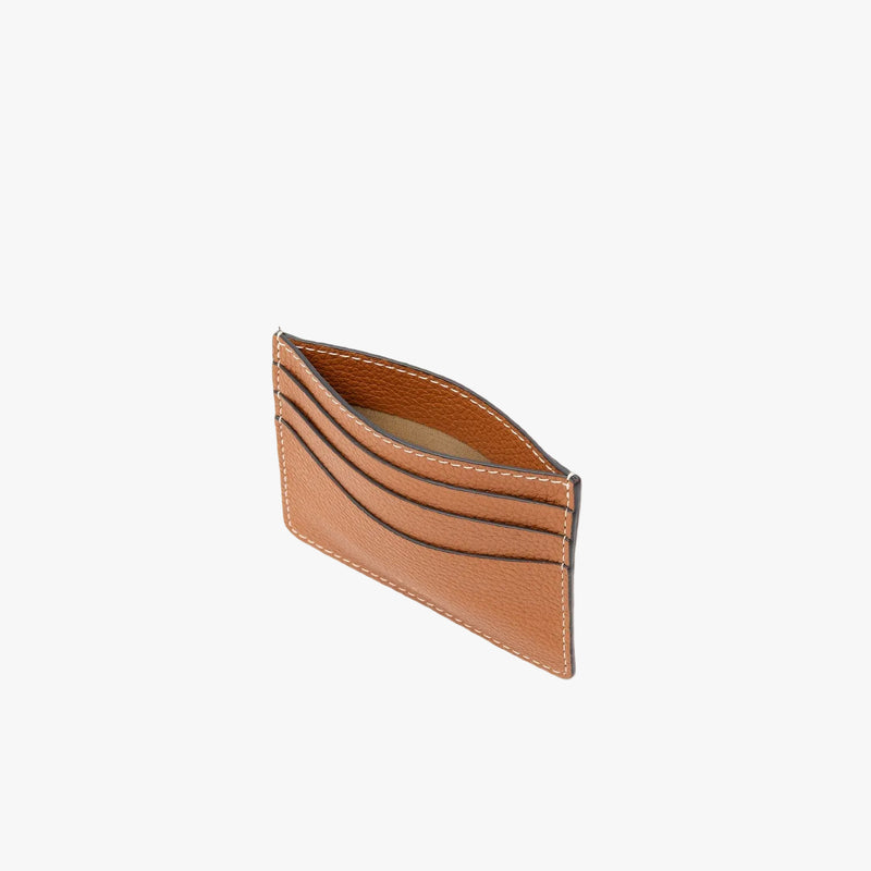 Top view of STOW London's Cardholder in Earth Tan pebbled leather on a light grey background 